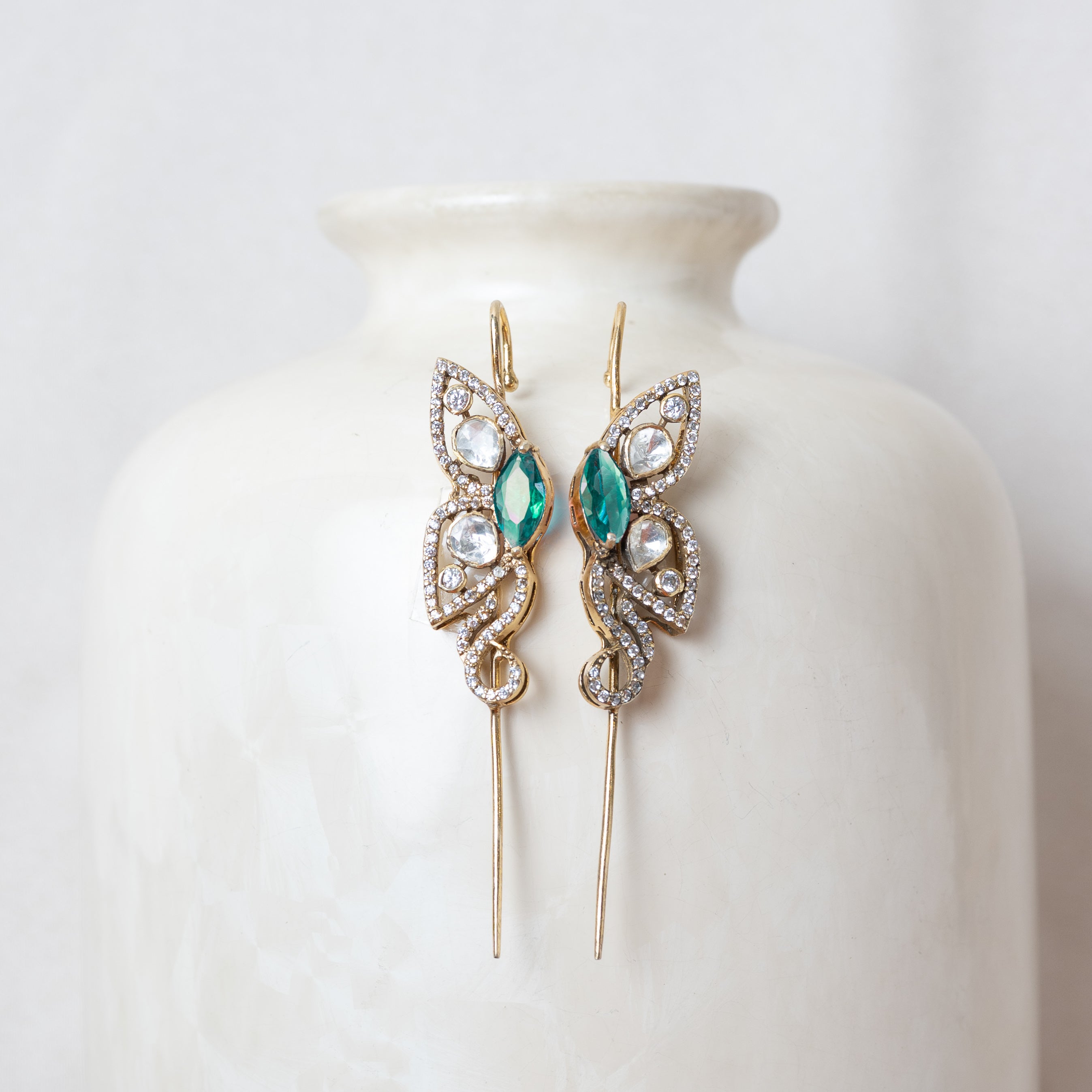 Victorian ear cuff with a teal green marquise and CZ pave wings in gold plated 925 silver