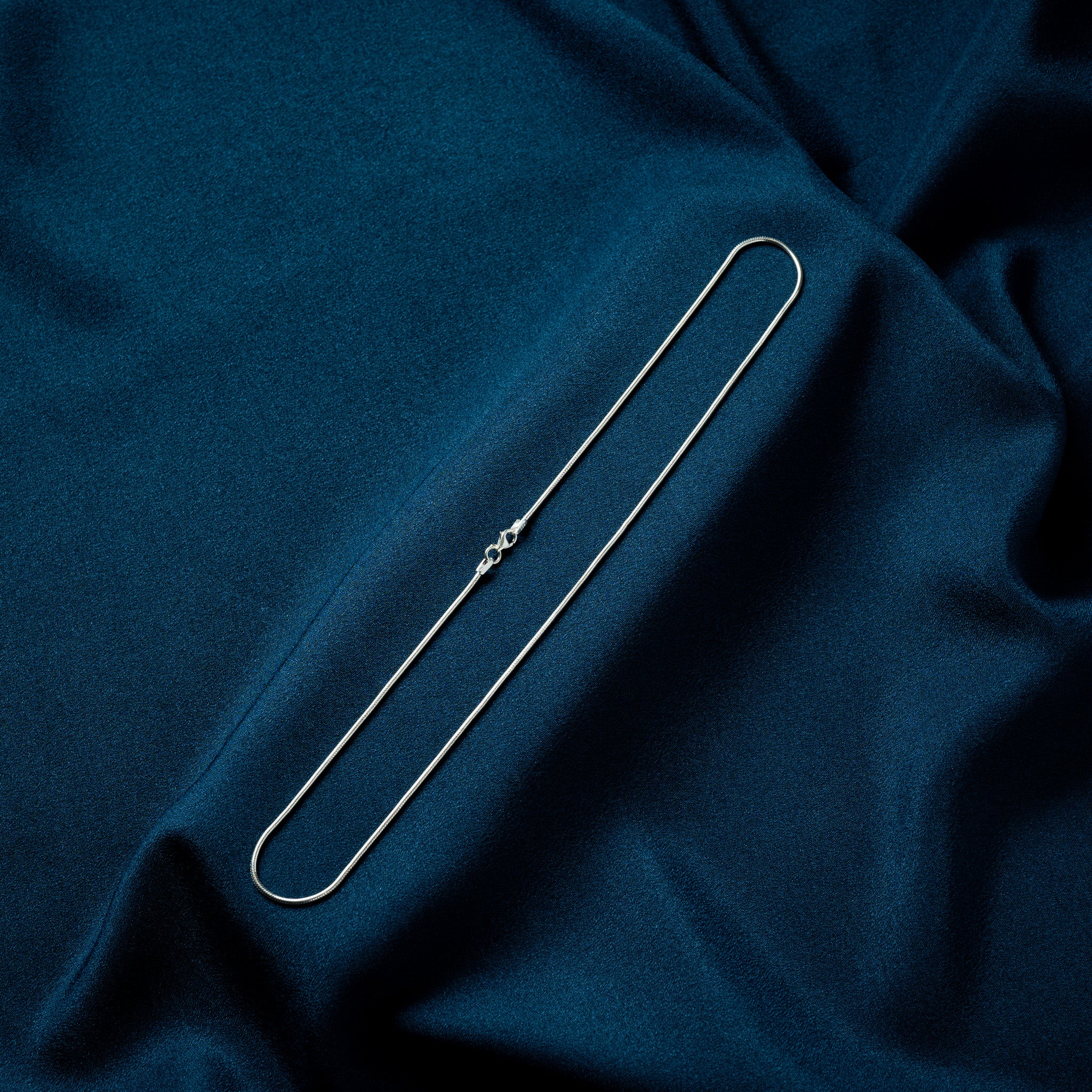 Snake link neckchain in plain 925 sterling silver, a smooth seamless tube at 1.2 mm