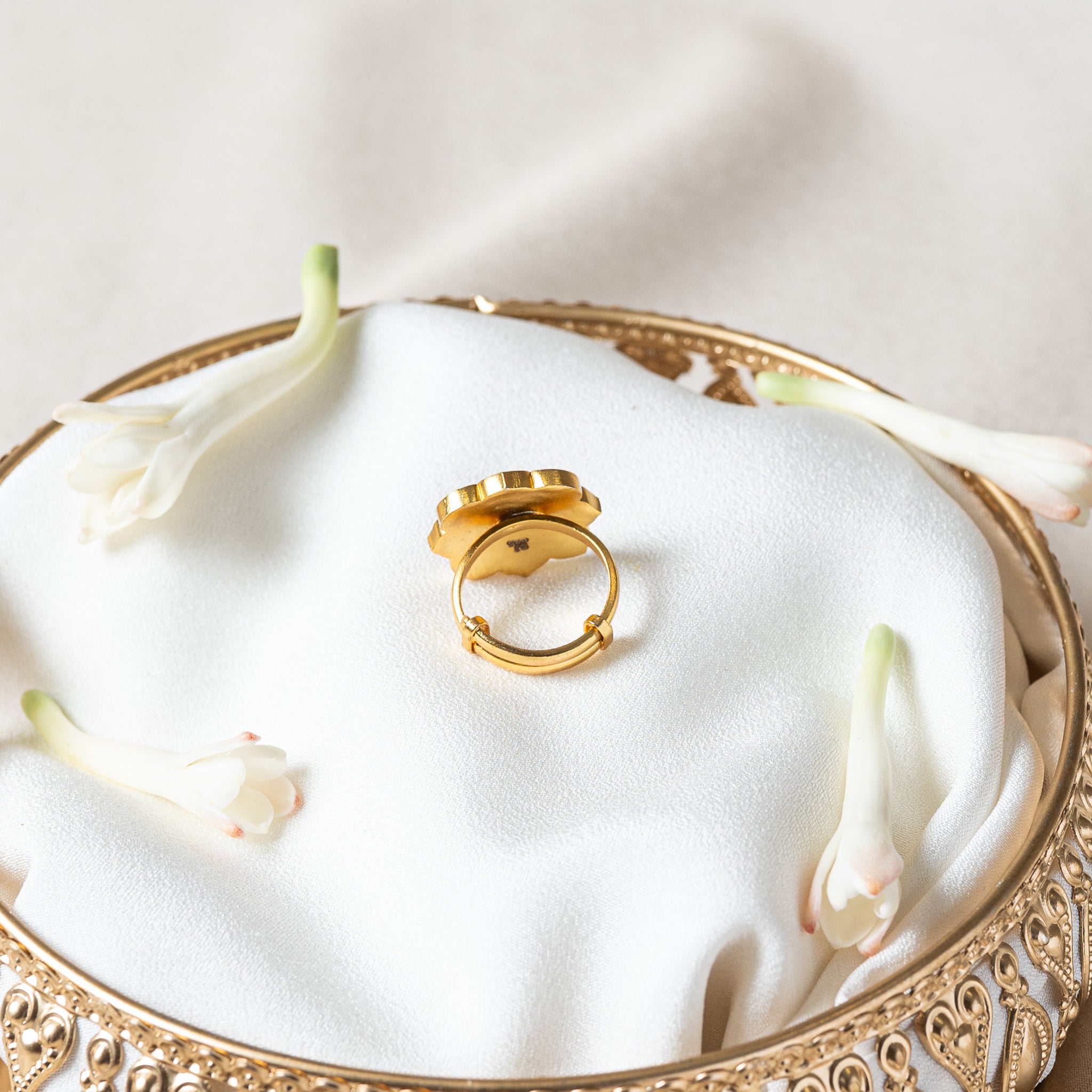 Back of the navratna ring showing the sliding tail of the band and the two small loops it runs through