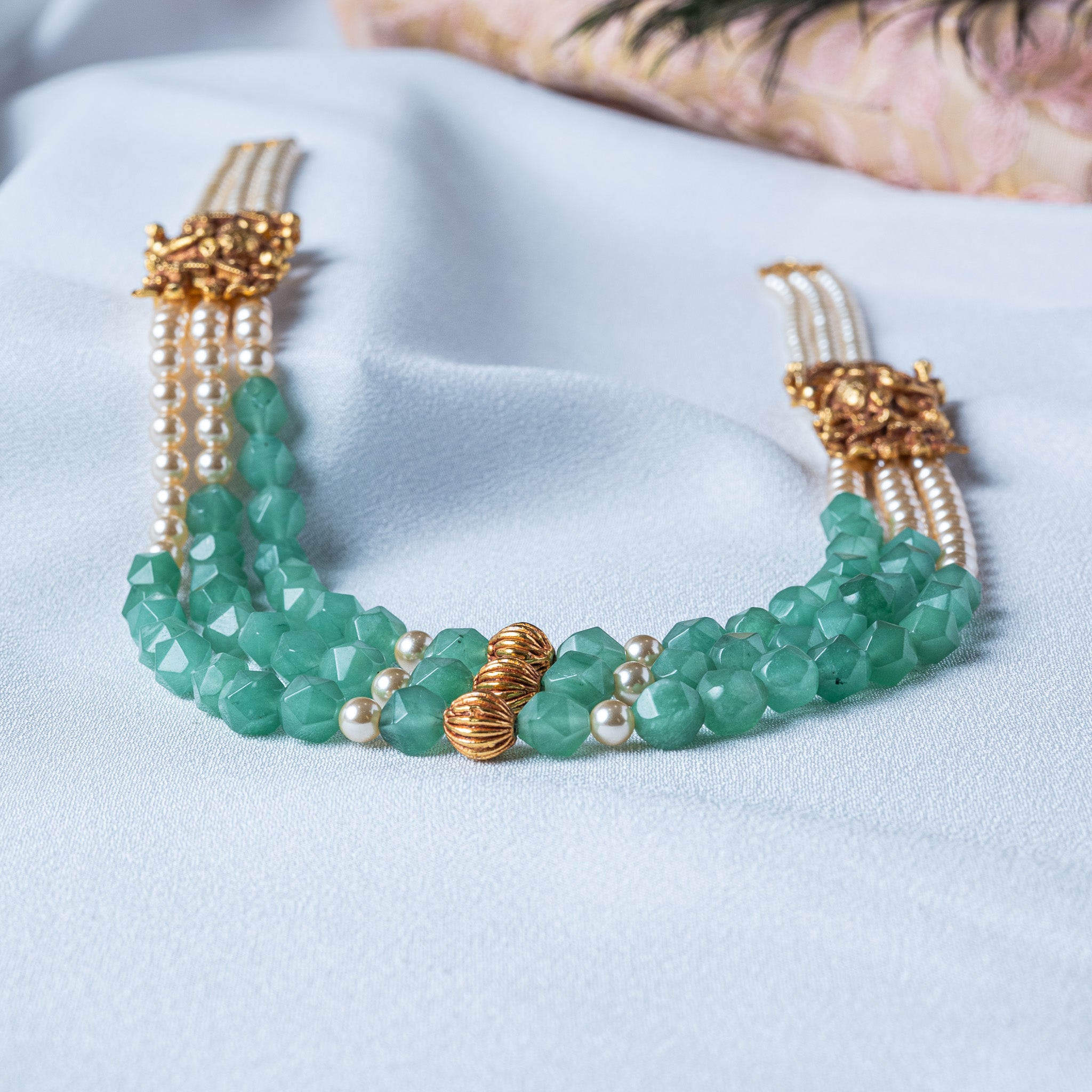 Side view of the eighteen inch three strand elephant necklace