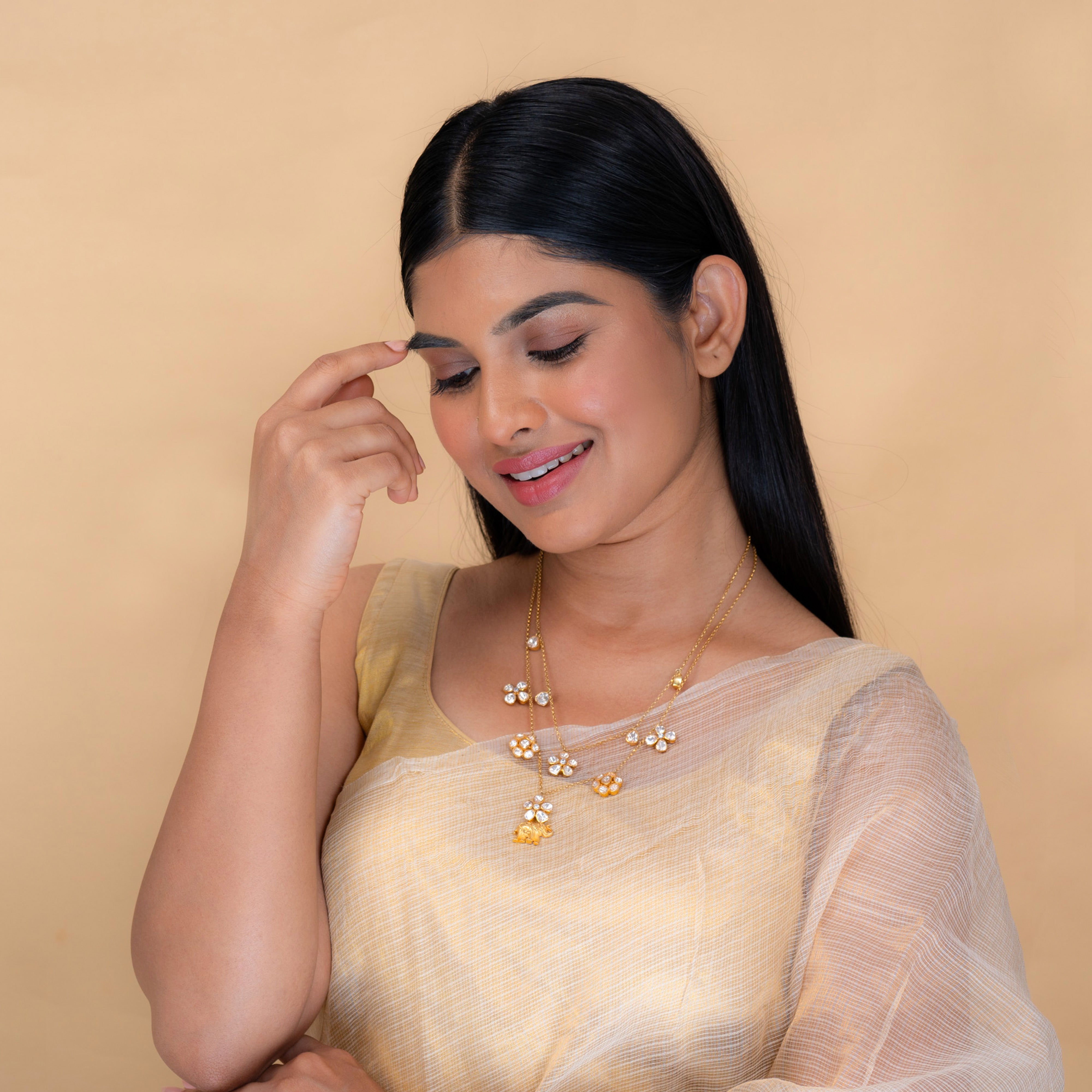 Minara Polki Necklace worn, featuring elephant motif and floral Polki detailing