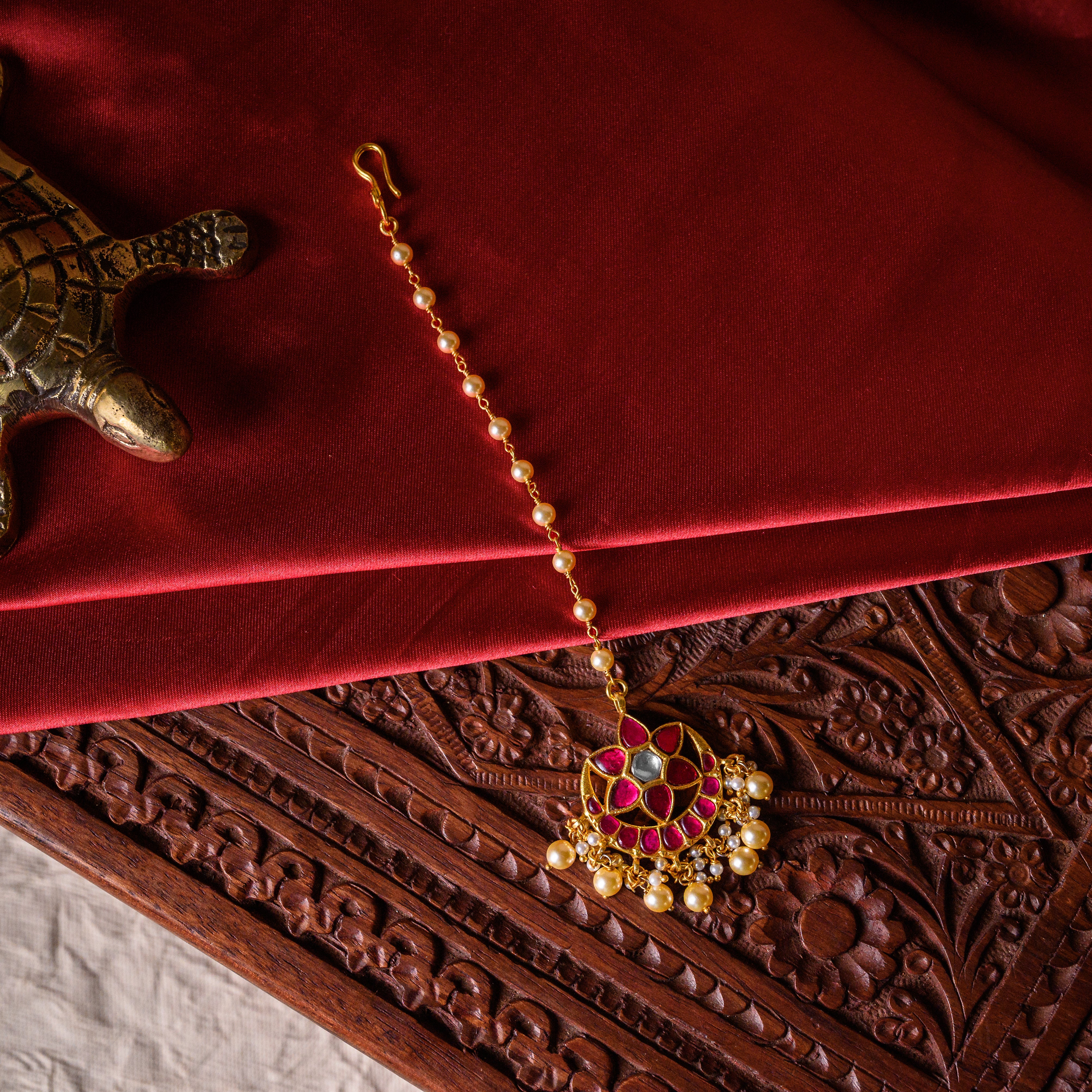 Traditional Kundan maangtika with pearls for weddings and festive occasions