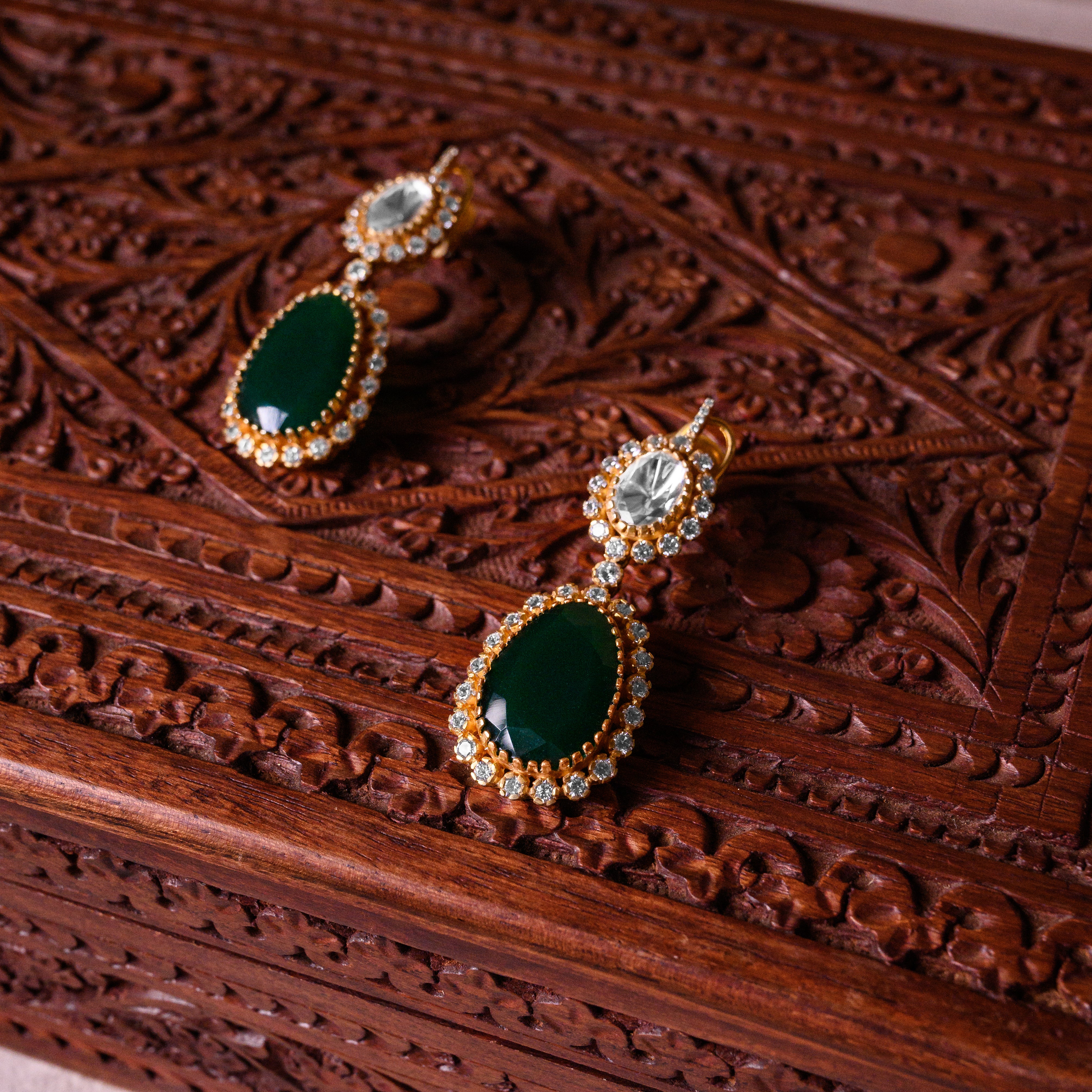 Close-up of Sienna Glow Polki hangings highlighting green onyx and polki craftsmanship