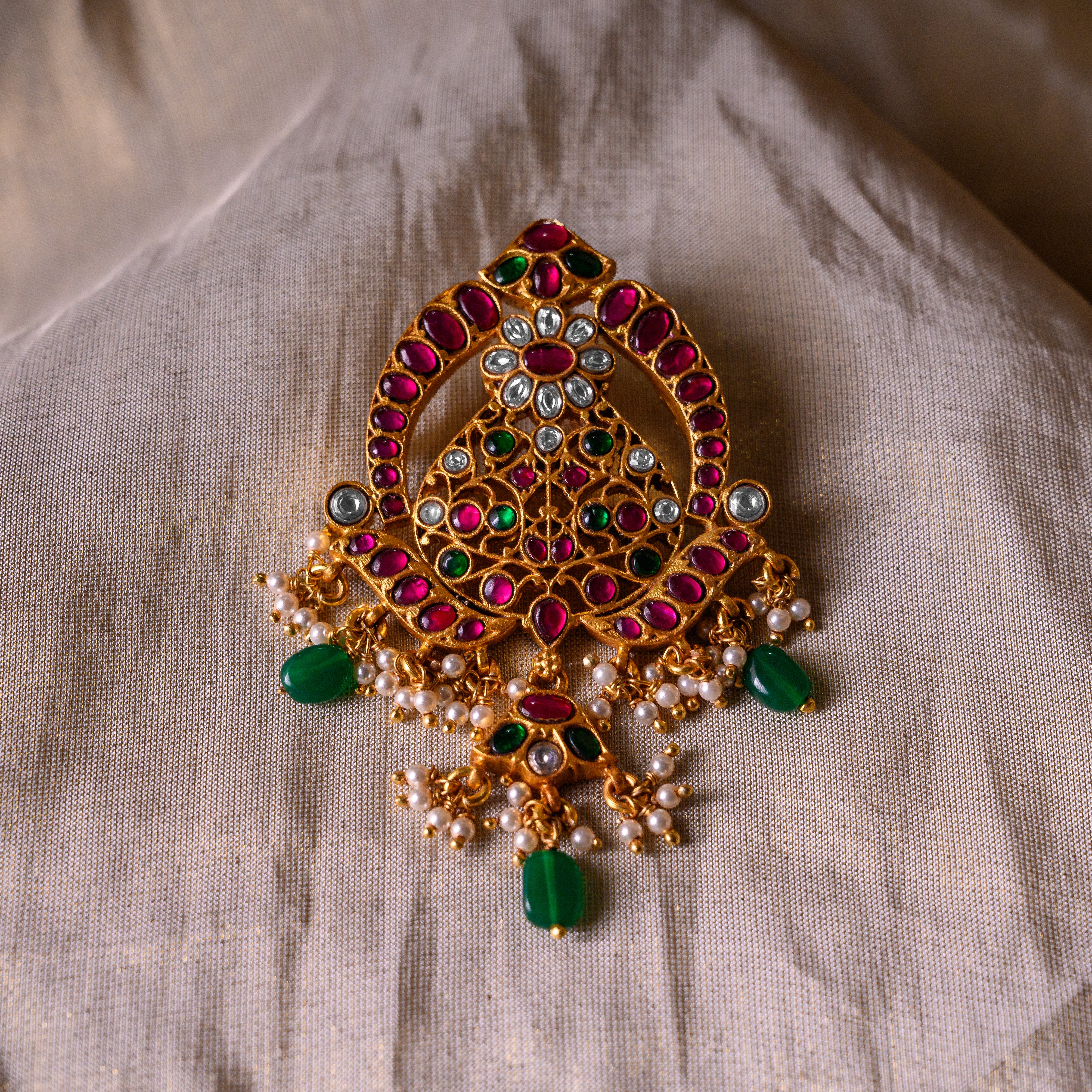 Close-up view of Kanirika Kundan silver pendant with heritage craftsmanship
