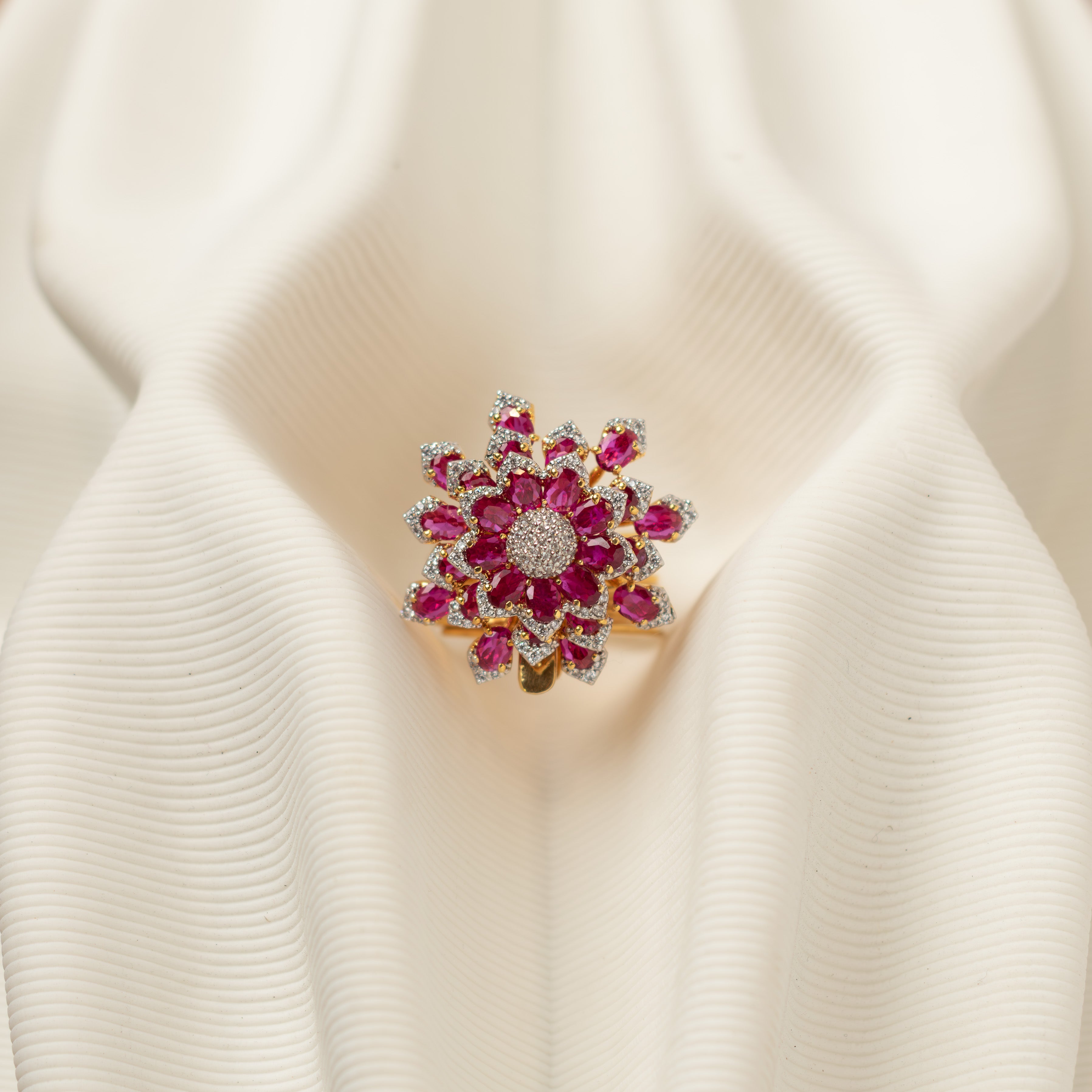 Close-up of Avira floral pink CZ polki ring with white stone accents