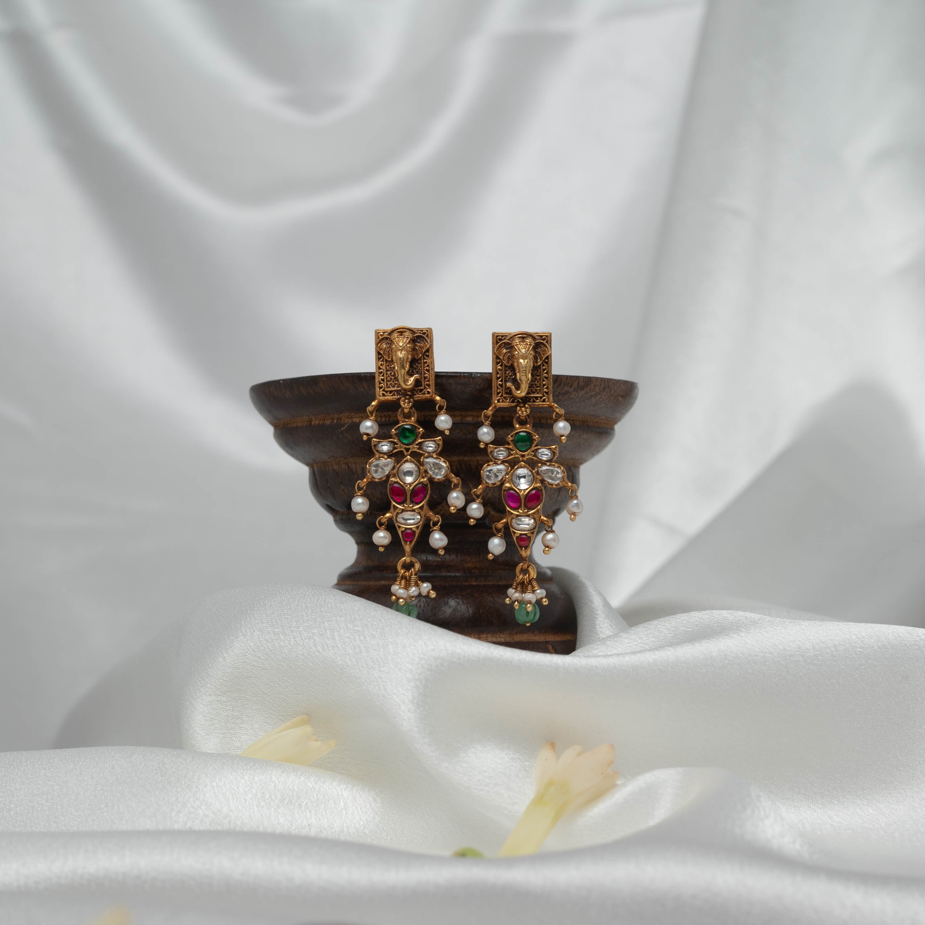 Cascading temple earrings with white kundan rows, red marquise stones and freshwater pearl drops