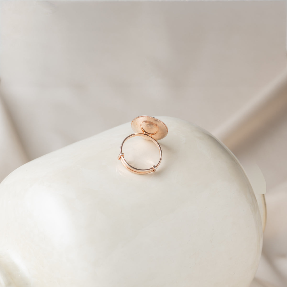 Back of the oval ring showing the open sliding band in rose gold plated 925 silver