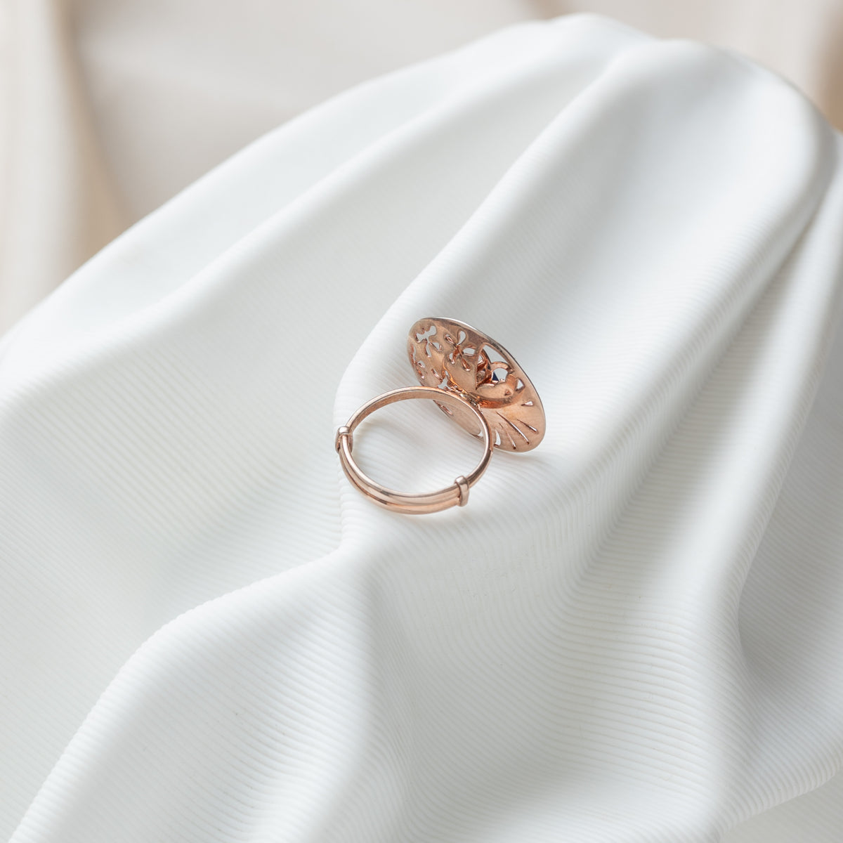 Back of the jaali disc ring showing the open sliding band in rose gold plated 925 silver