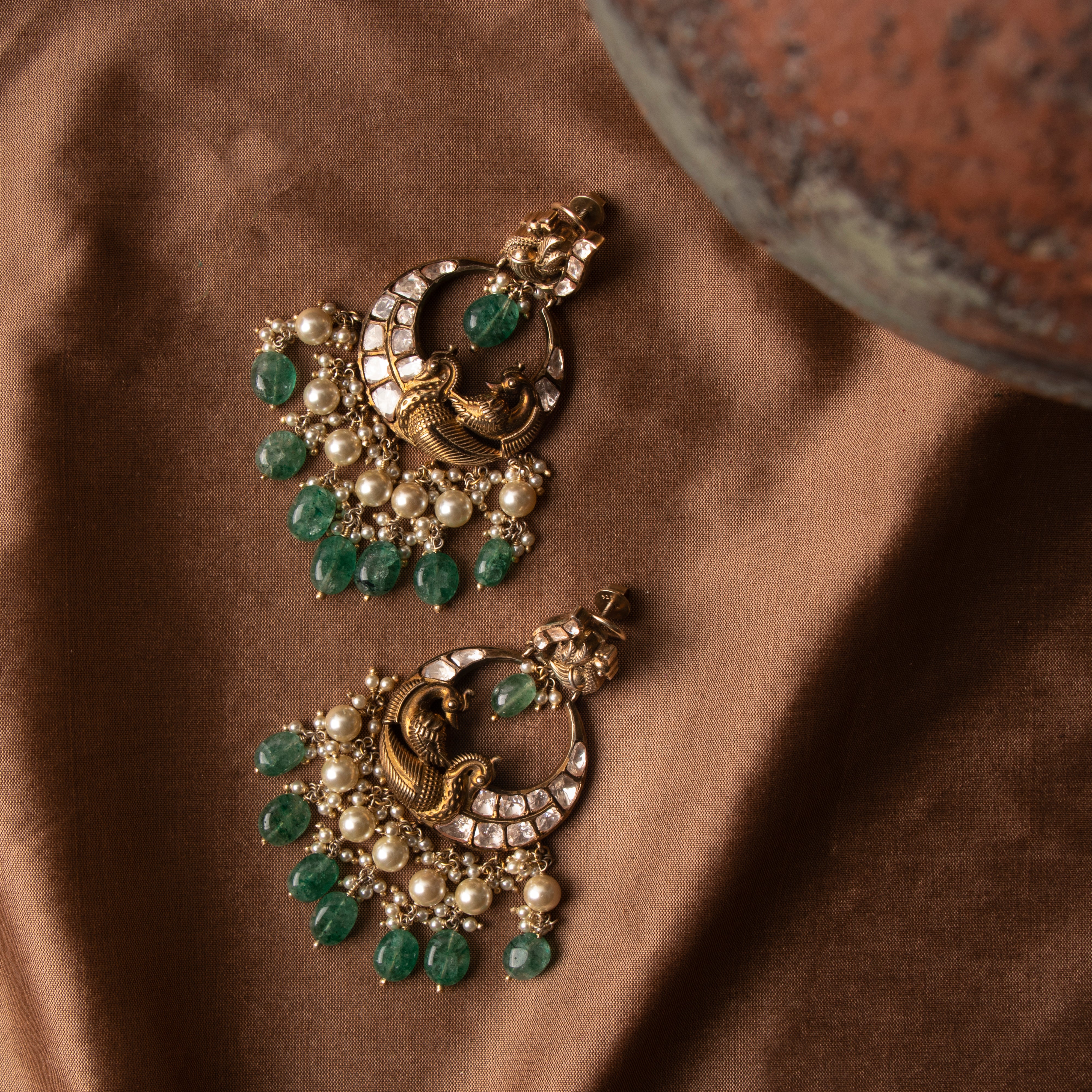 Top view of Amara polki chaandbali showcasing intricate detailing, Victorian polish, and pearl bead drops