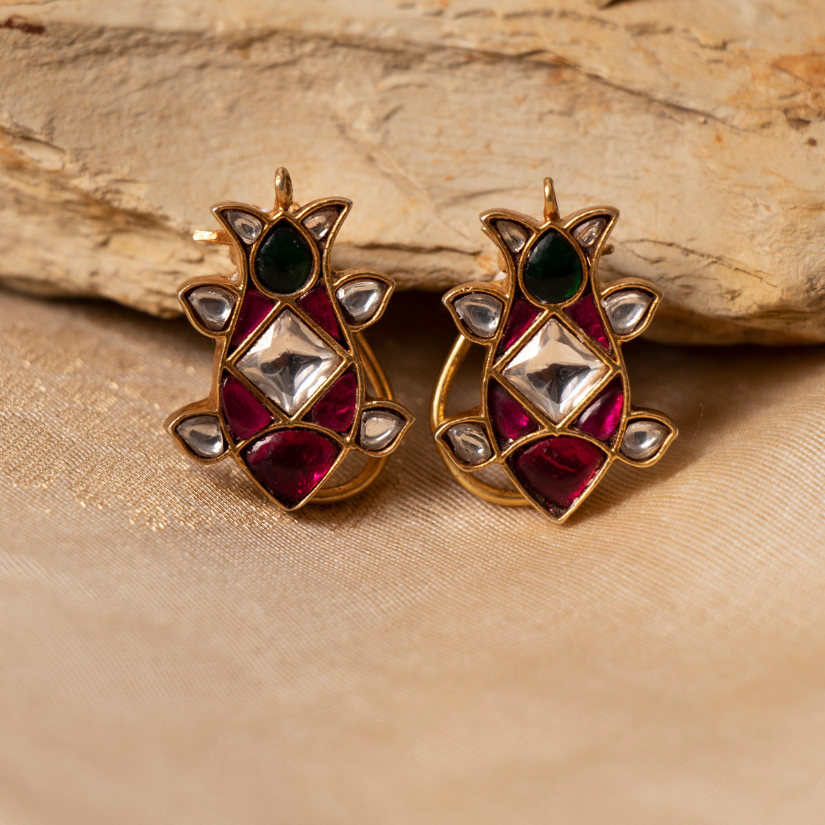 Lotus bud studs with square white kundan, pink-red surround and green pear top, gold plated