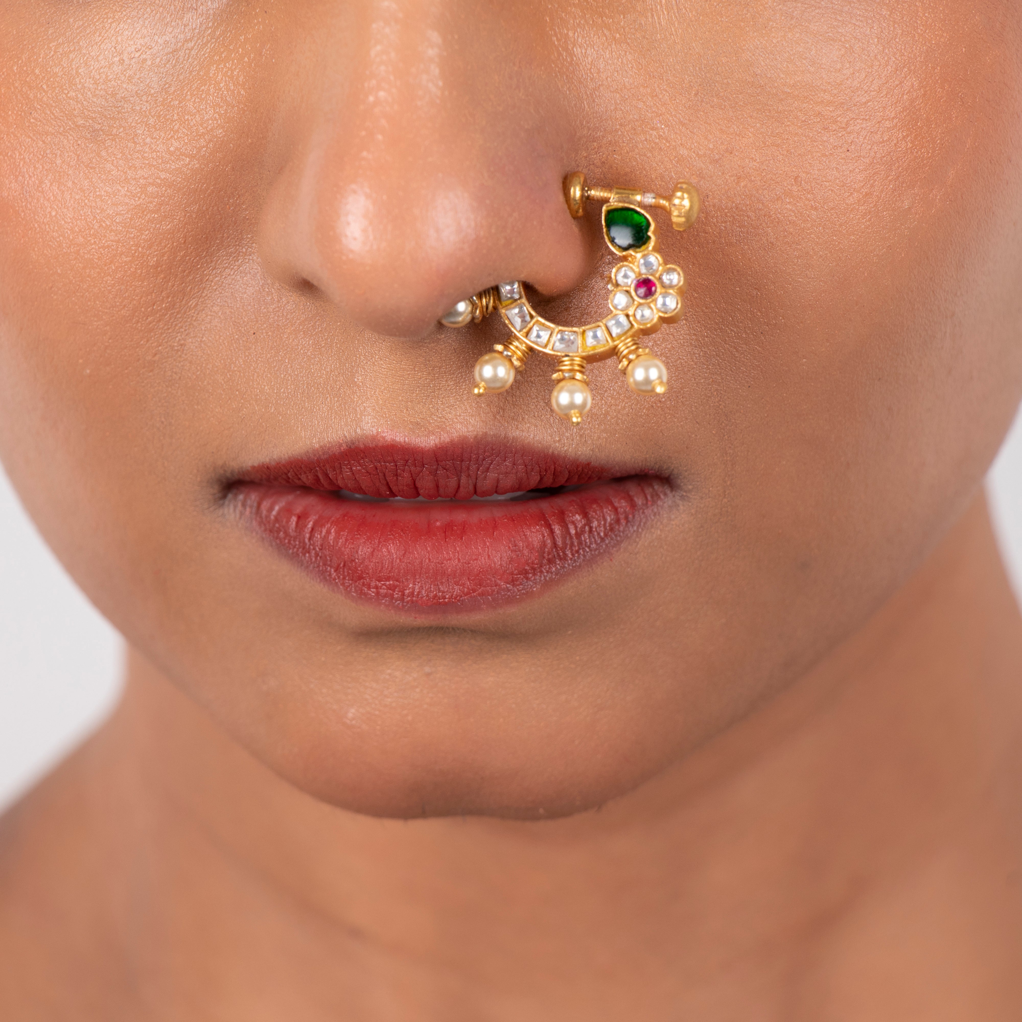 Model wearing Chandini Kundan 925 silver nath styled for traditional occasions