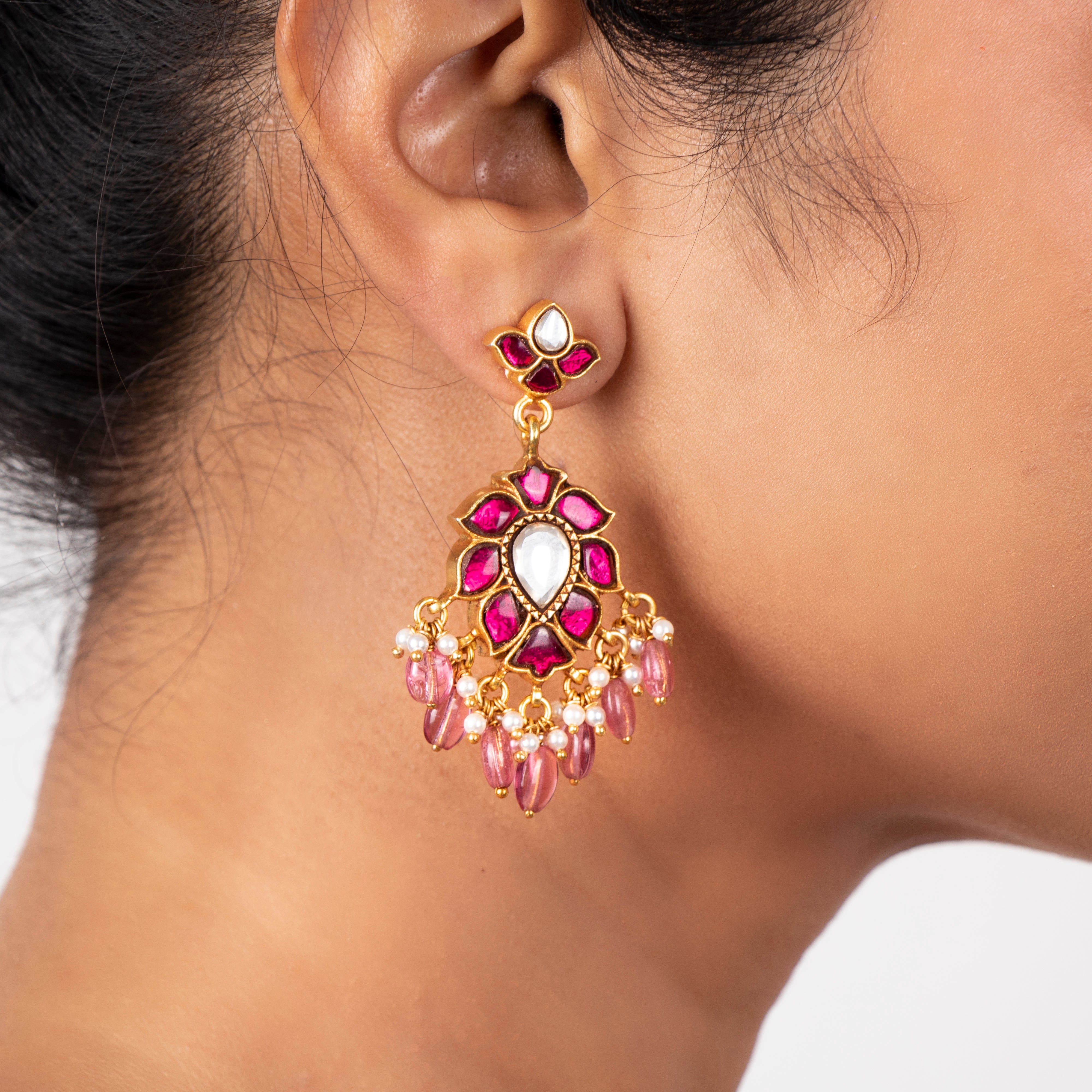 Woman wearing Kalila red kundan danglers styled for festive traditional look
