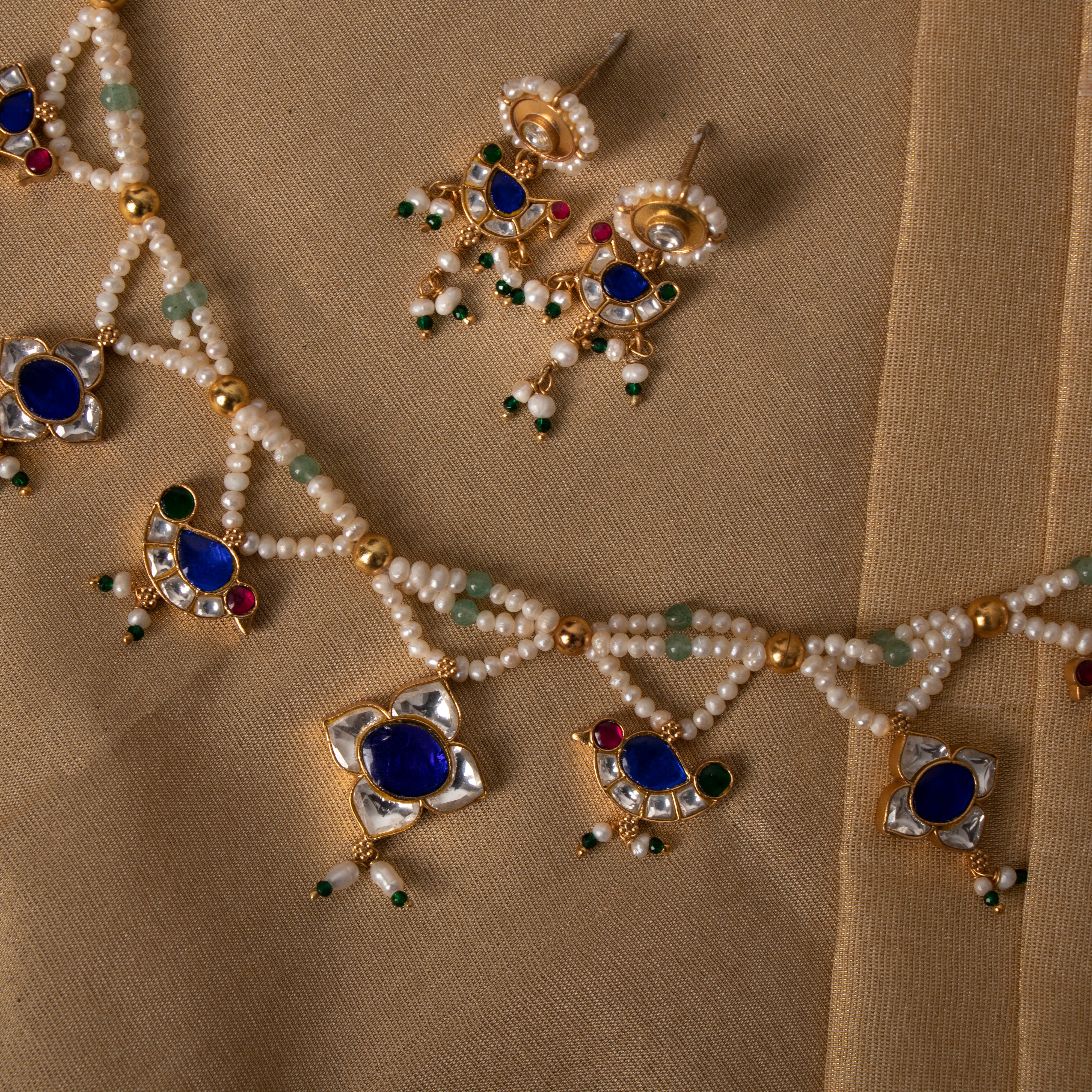 Blue Kundan bird motif earrings in 925 silver with freshwater pearls