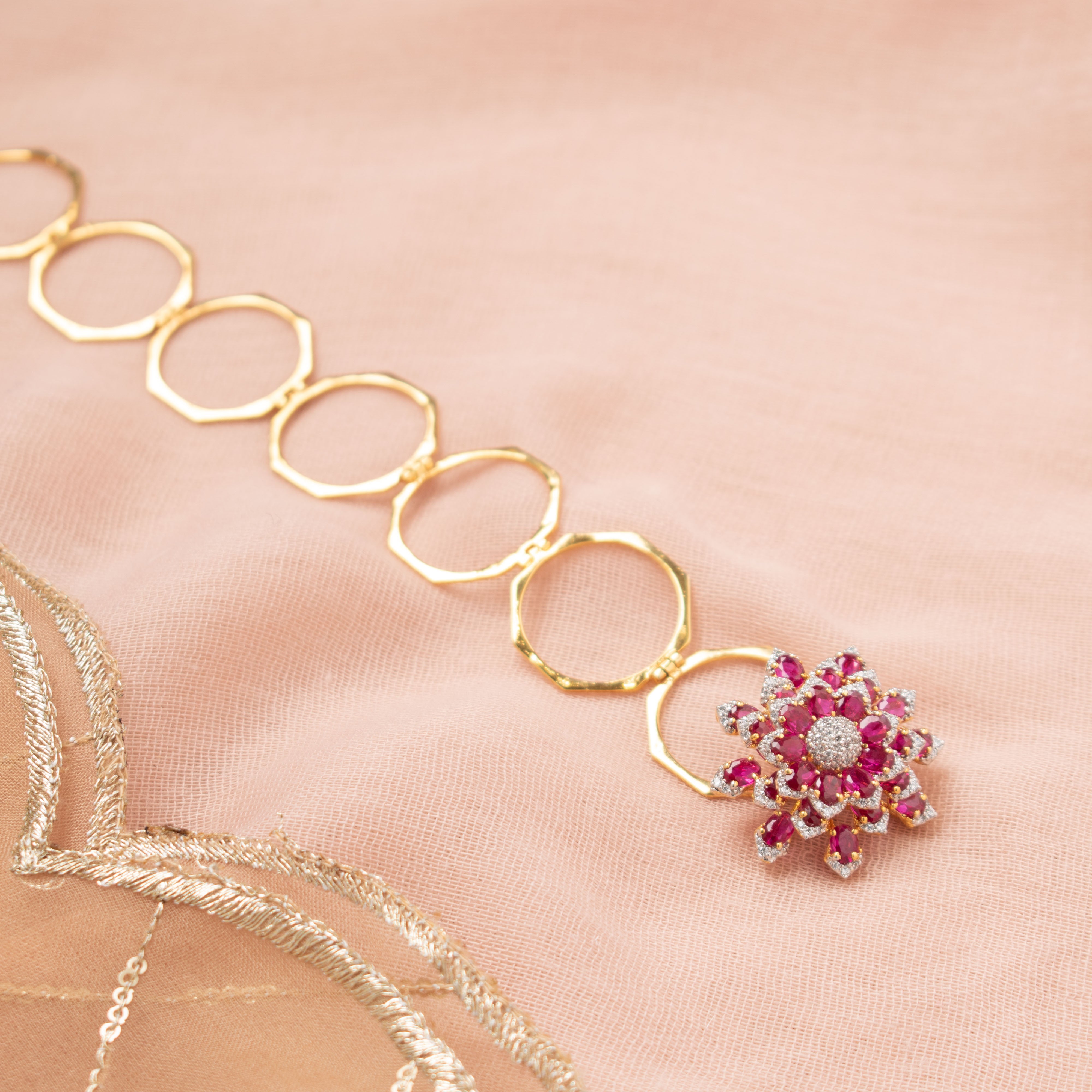 Avira pink polki ring bracelet with floral motif and gold-polished haathphool design
