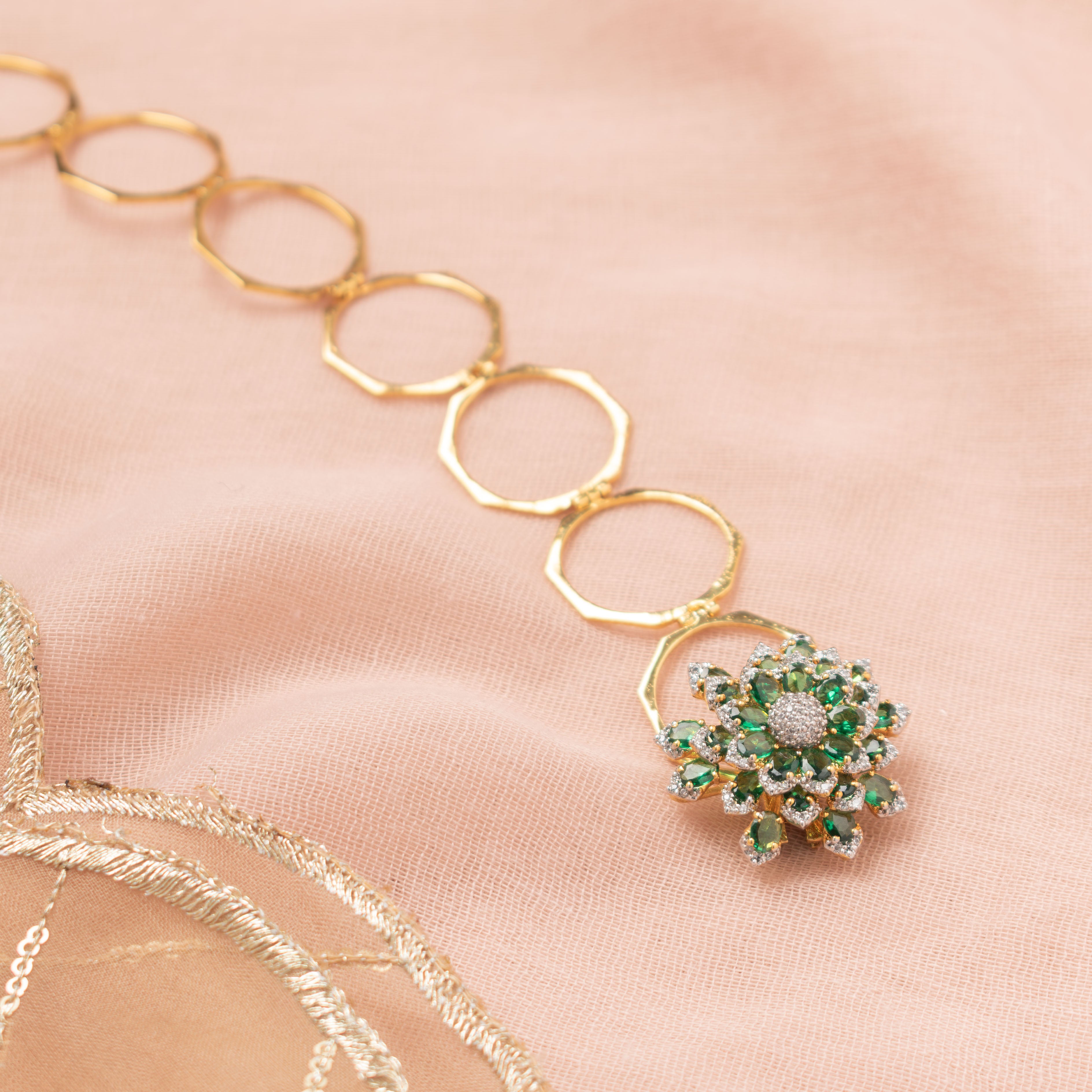 Avira green polki ring bracelet with floral motif and gold-polished haathphool design