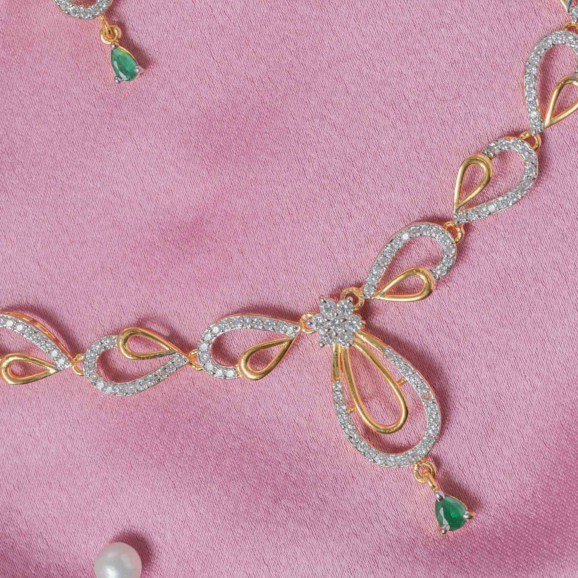 Full necklace laid with its matching emerald drop earrings in gold plated 925 silver