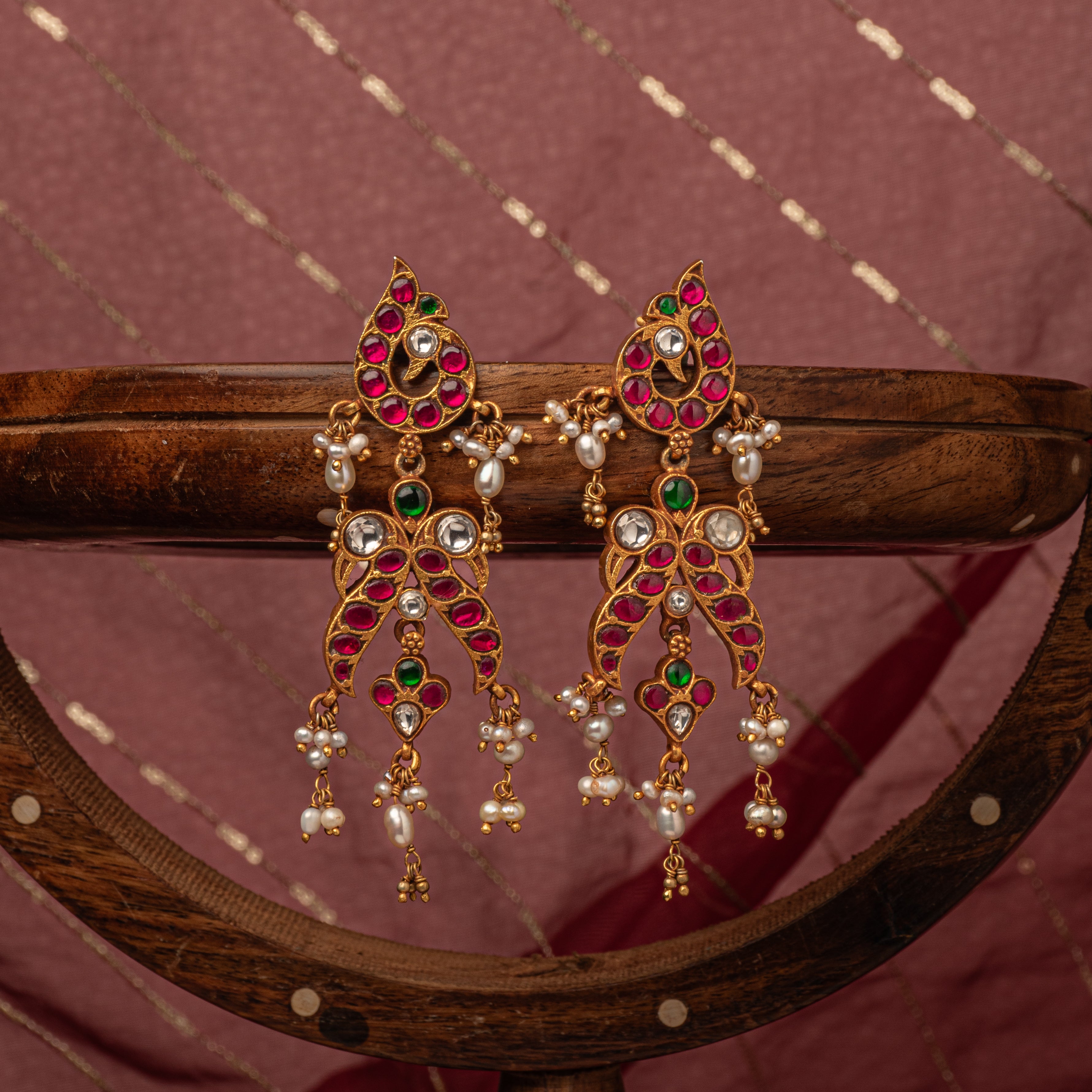 Pearl tassels falling from the paisley kundan frame, antique gold finish 925 silver