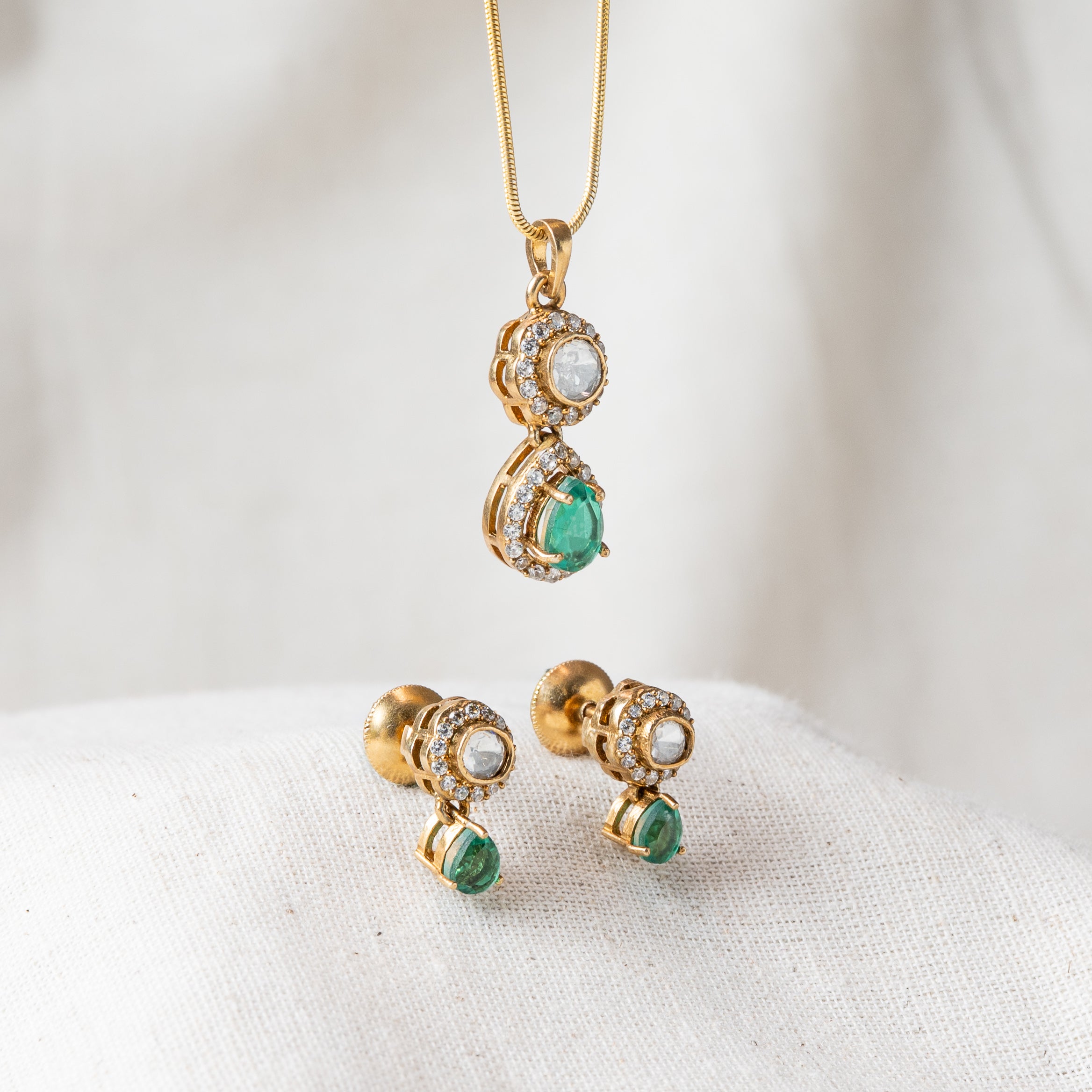 Polki and pear cut emerald pendant with matching studs, layered drops in gold plated 925 silver