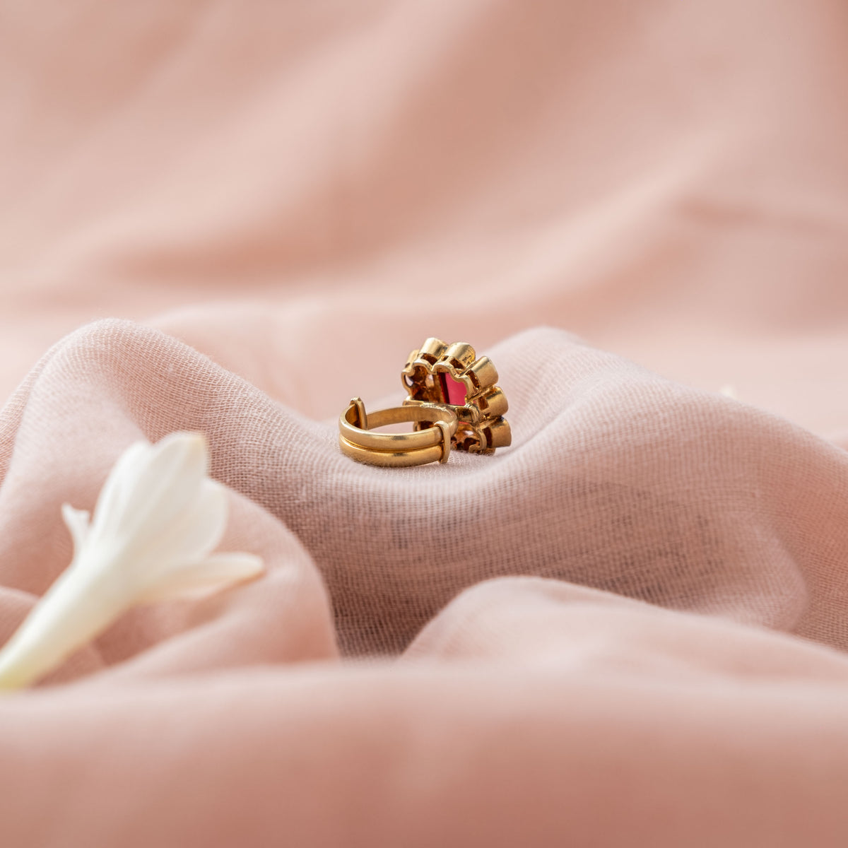 Open adjustable band behind the square polki ring in gold plated 925 silver