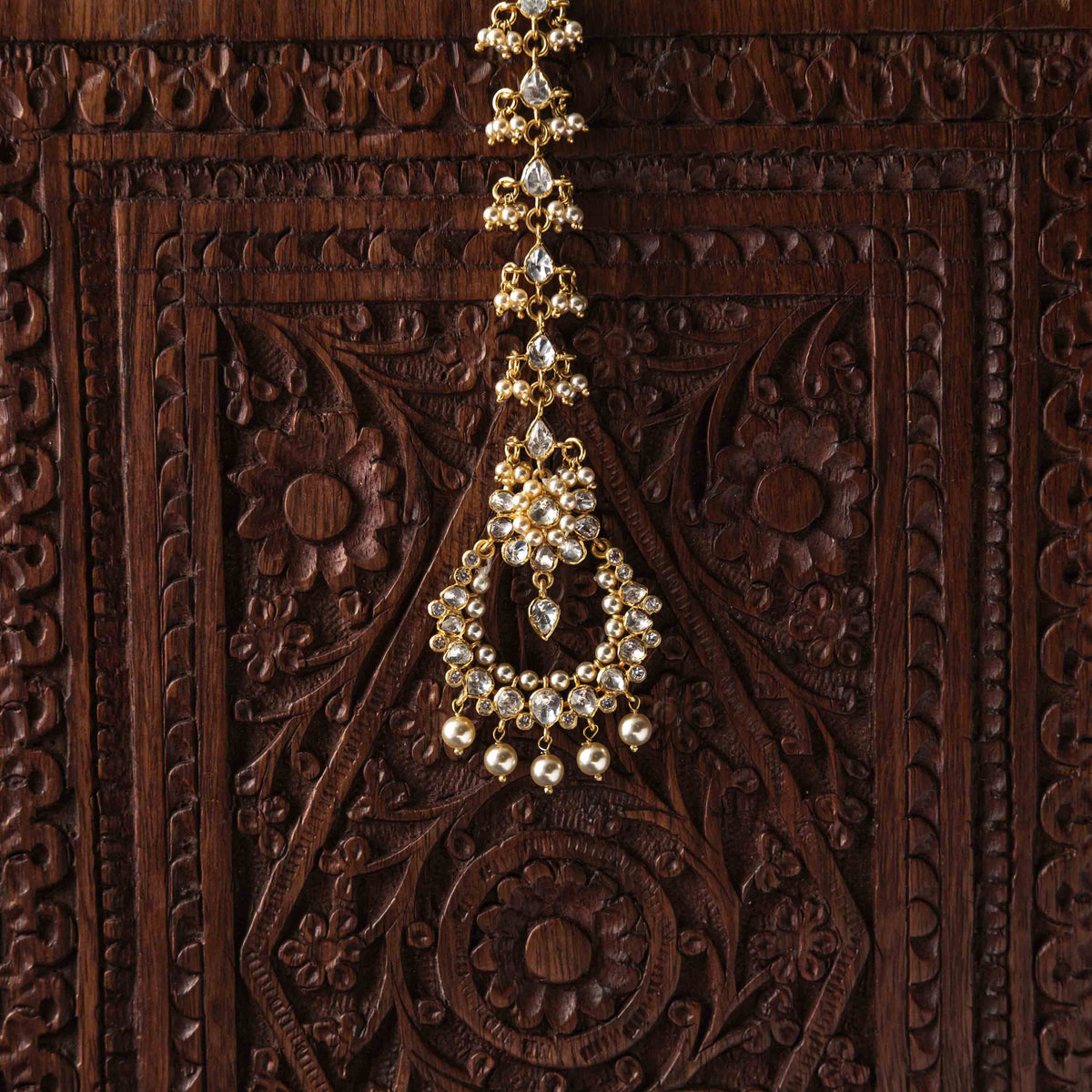 Tiered polki florals ending in a seed pearl fringe, raised at an angle on gold plated silver