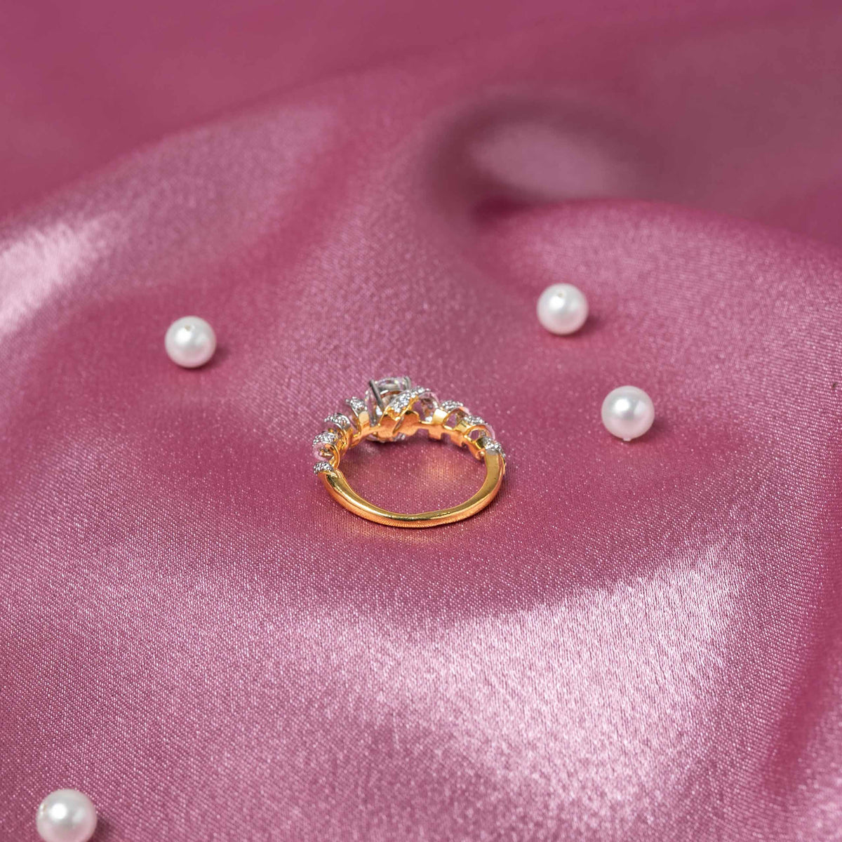 Side profile of the channel set white CZ stones running along a slim sterling silver band