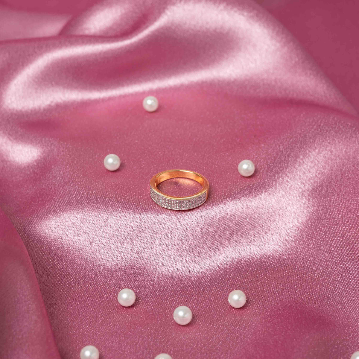 Close view of the single white CZ stone and the smooth unset band of the silver ring