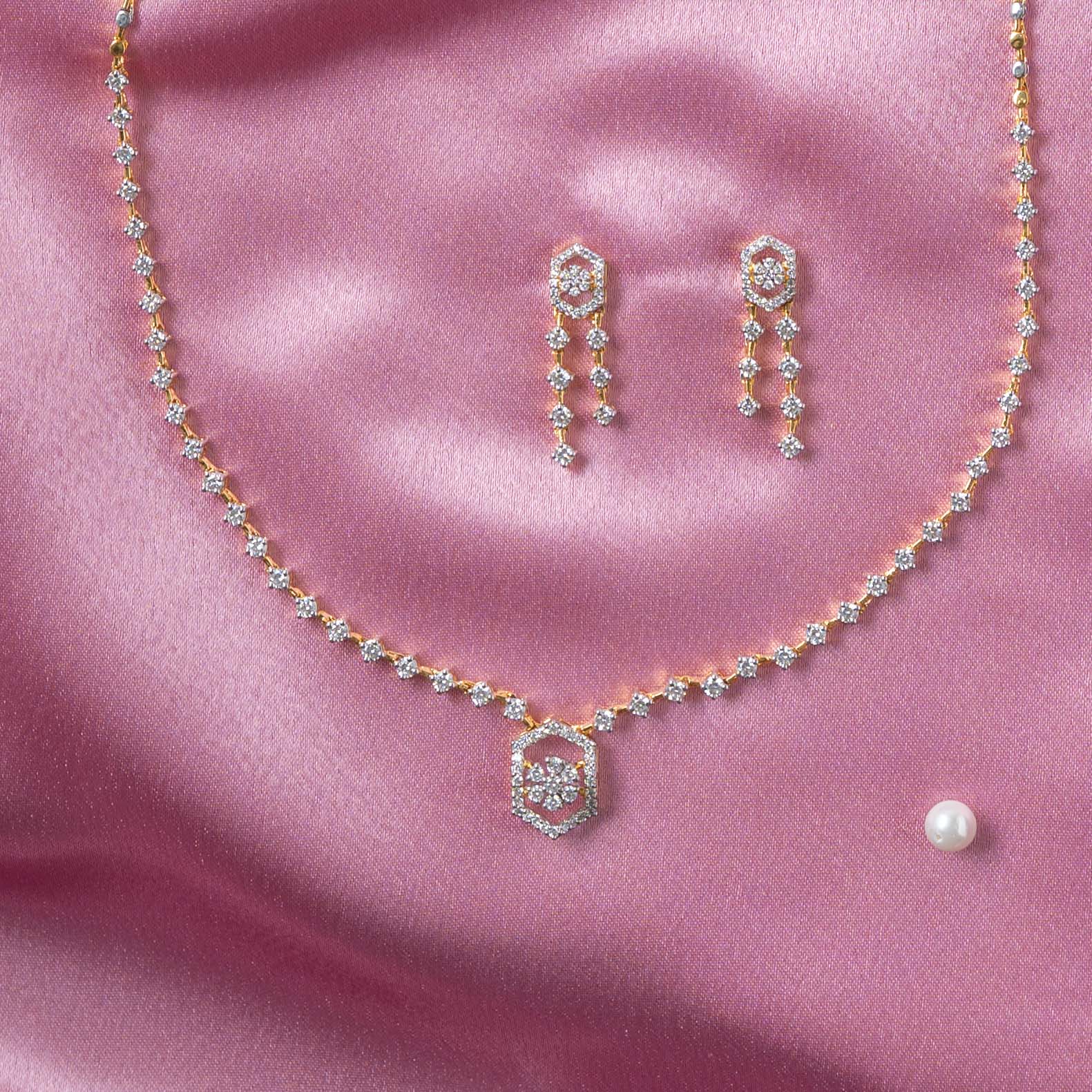 Back view of one earring showing the Bombay screw back post behind the hexagonal CZ drop