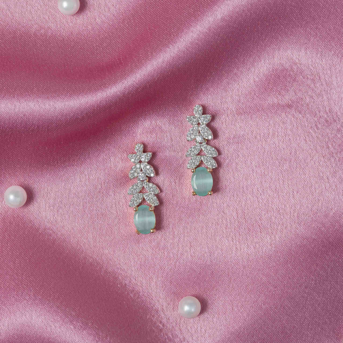 Leaf-shaped CZ hangings with oval turquoise-green drops in 925 silver