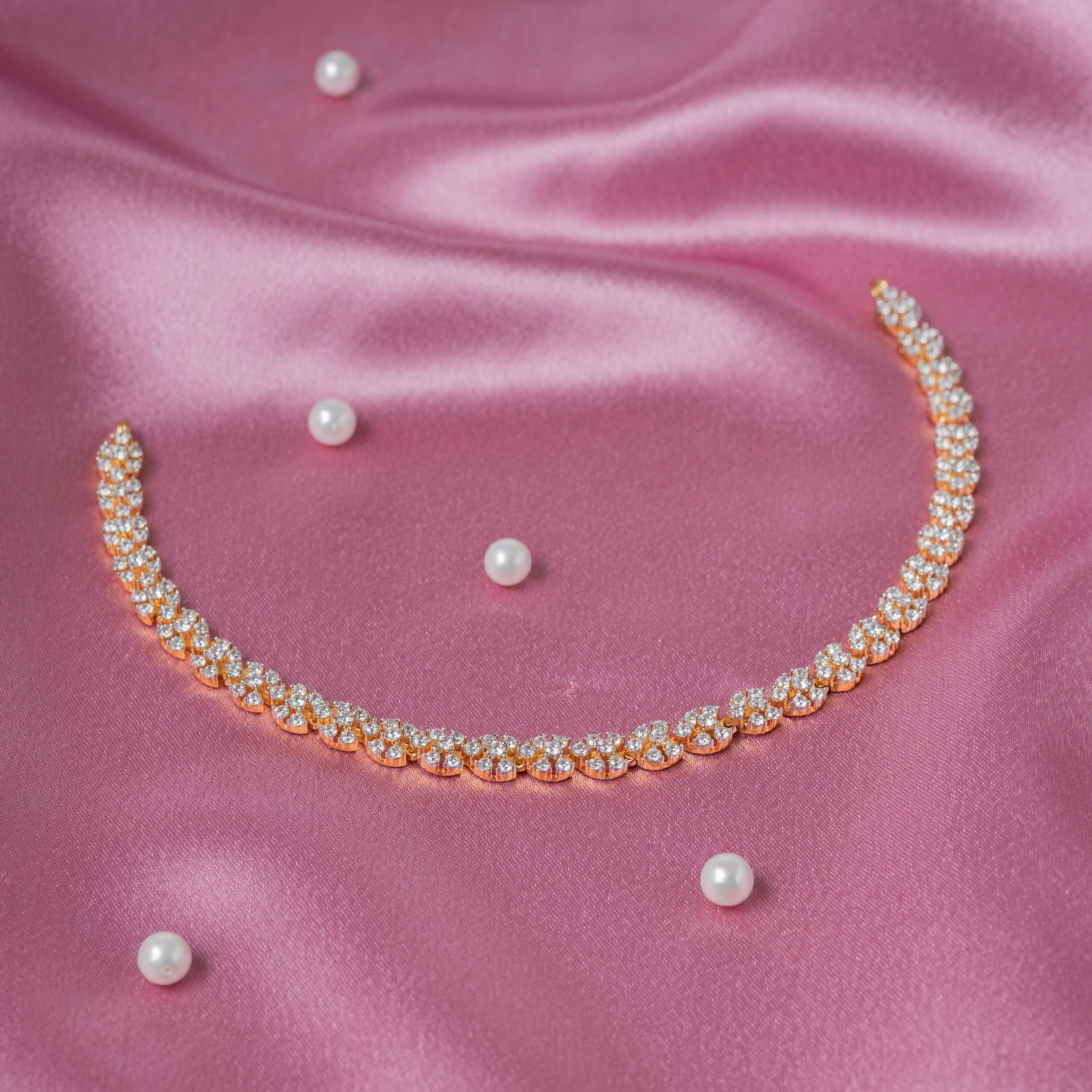 Short floral necklace of continuous CZ paved links in gold plated 925 silver