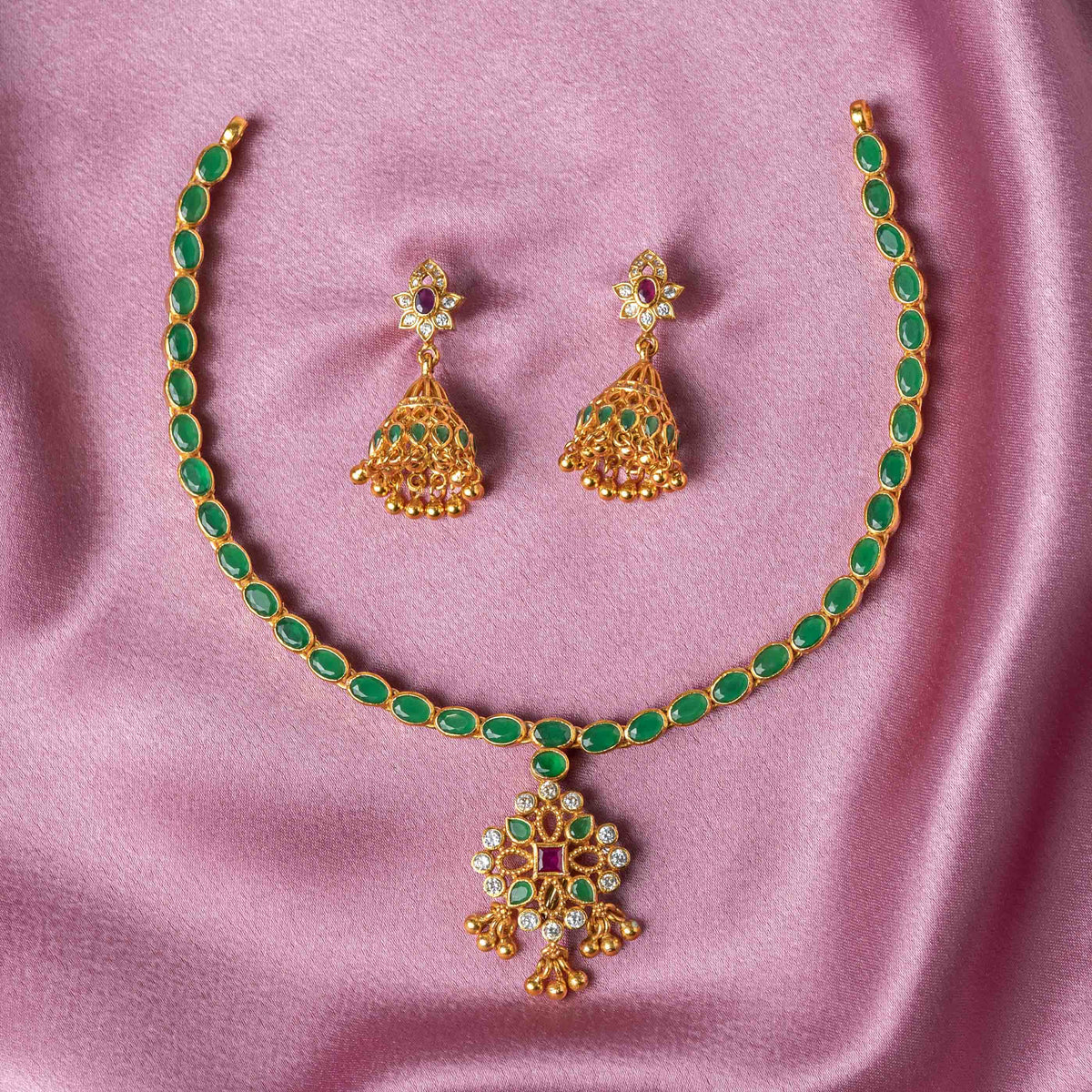 Bombay screw back behind the white CZ floral top of the gold plated jhumka in 925 silver