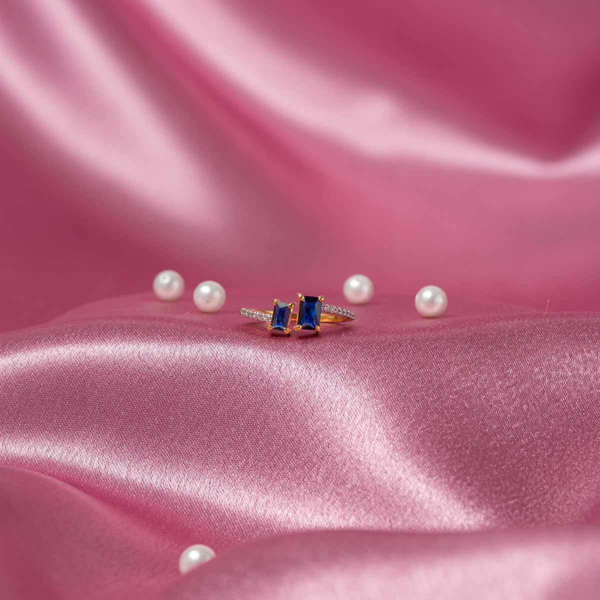 Deep blue rectangular stones with white CZ accents on a slim 925 silver band