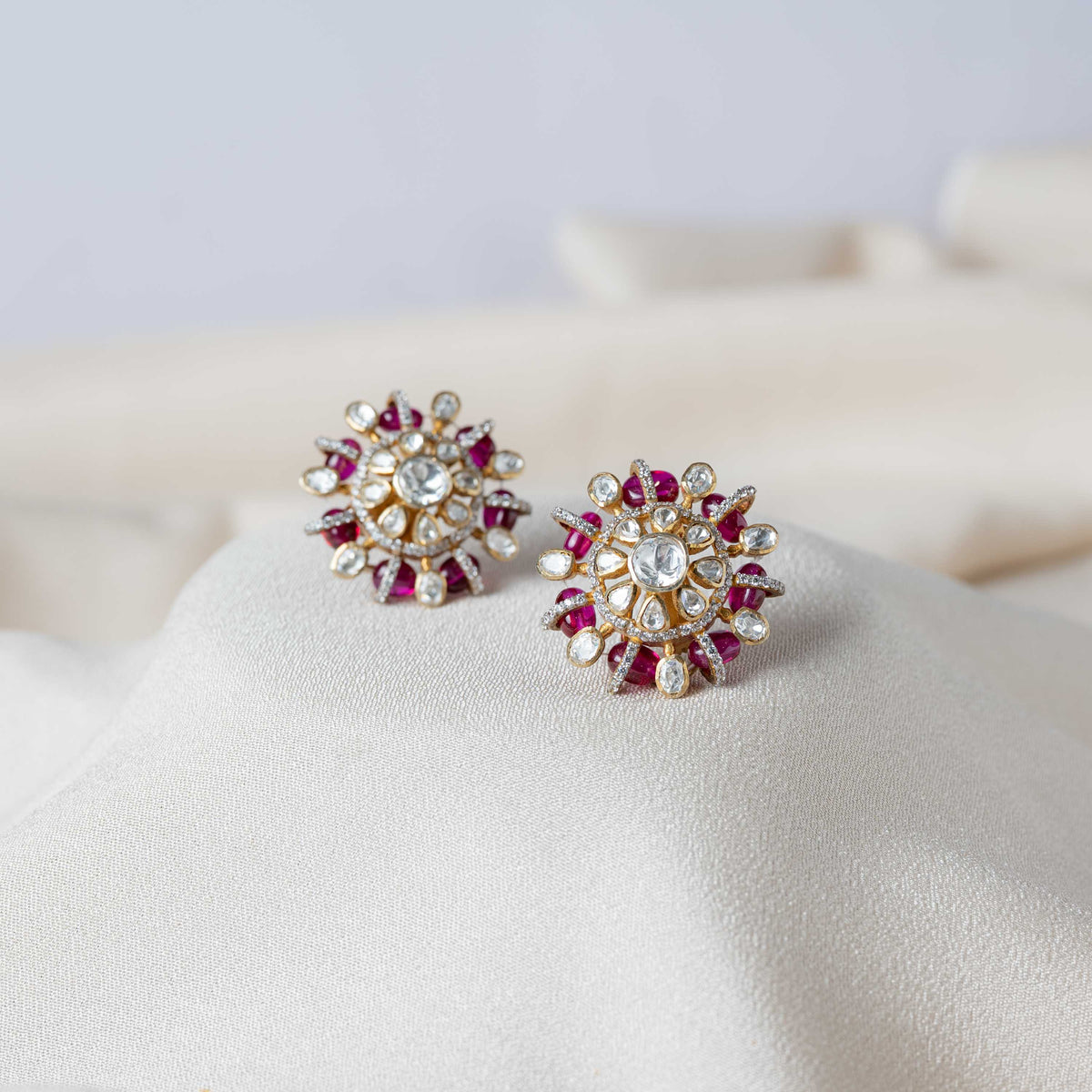 Round polki studs with red bead borders and CZ centres in gold plated 925 silver