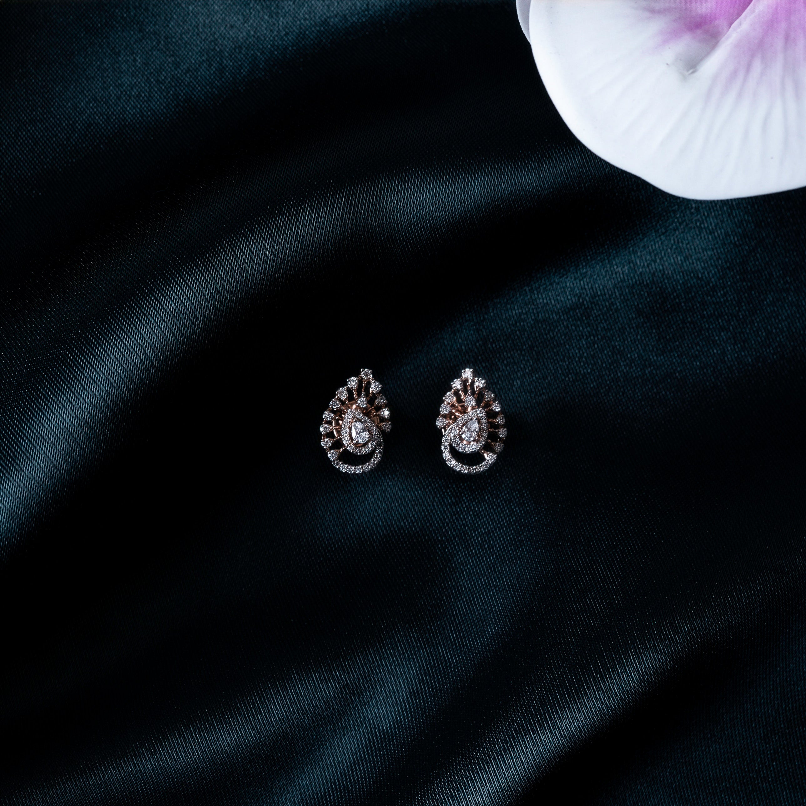 Paisley studs with push backs, one turned to show the post, CZ pave in rose gold plated silver