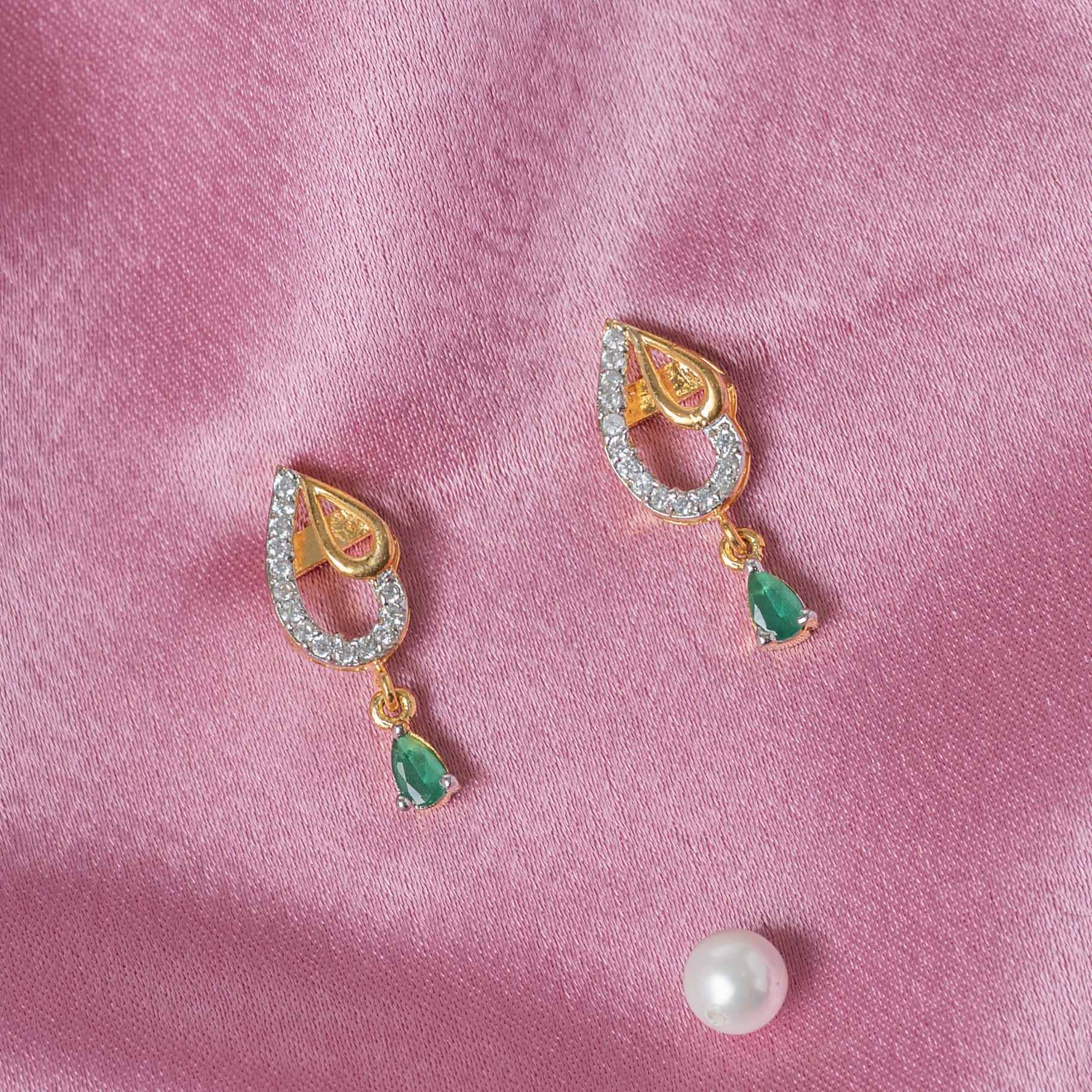 Close view of the CZ set teardrop cutout and the pear shaped emerald drop, gold plated 925 silver