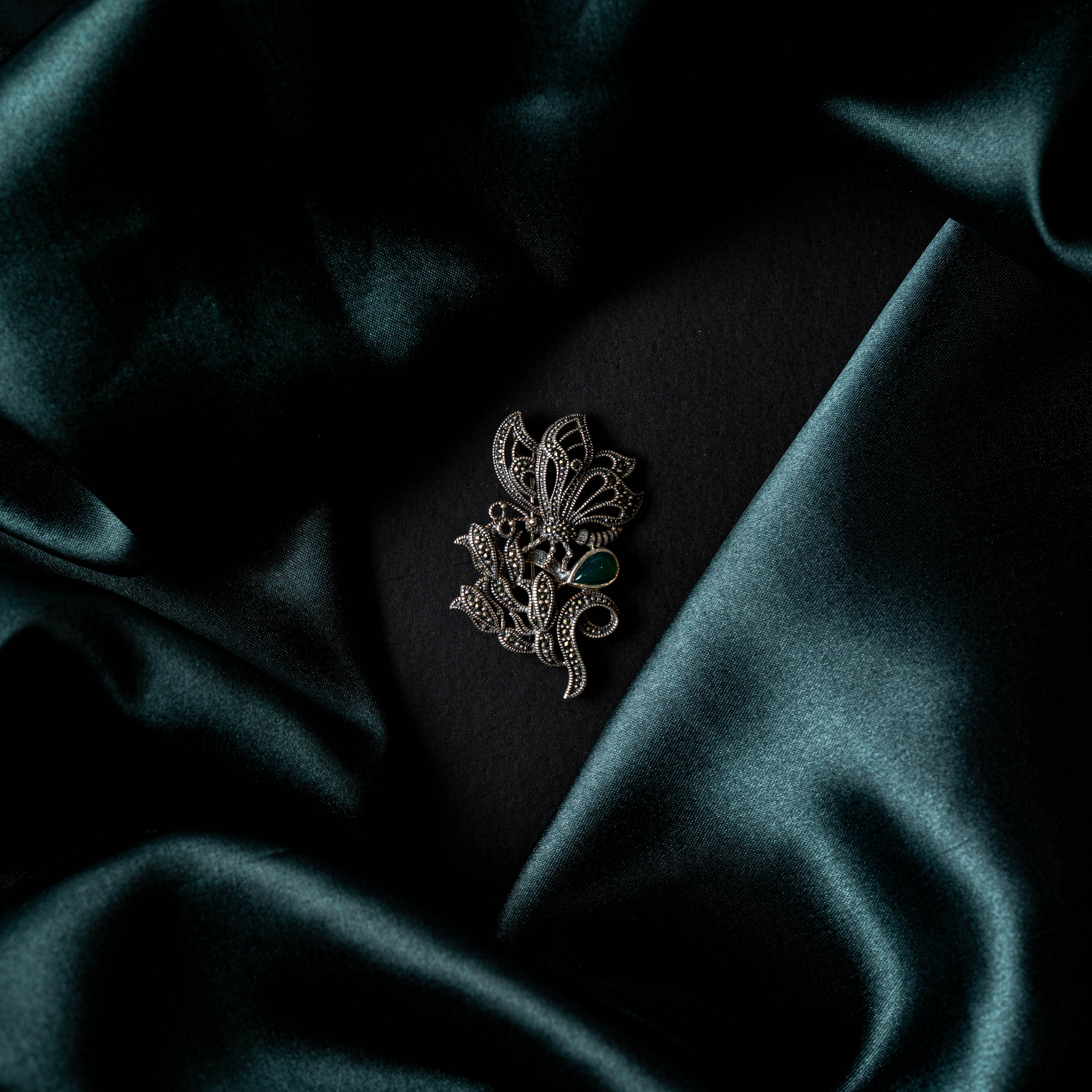 Back of the floral brooch showing the pin and catch fitting in oxidised 925 silver