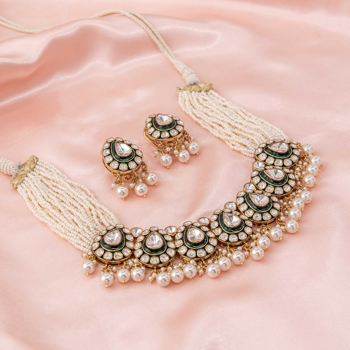 Seed pearl strands and adjustable dori at the back of the short polki necklace, gold plated silver
