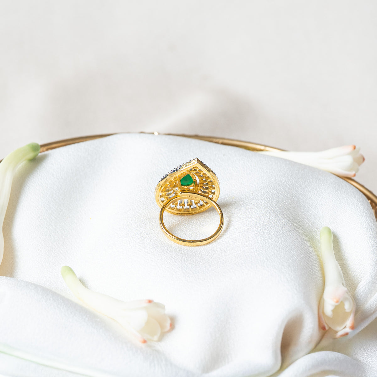 Back of the teardrop ring showing the plain closed gold band, made to a fixed ring size