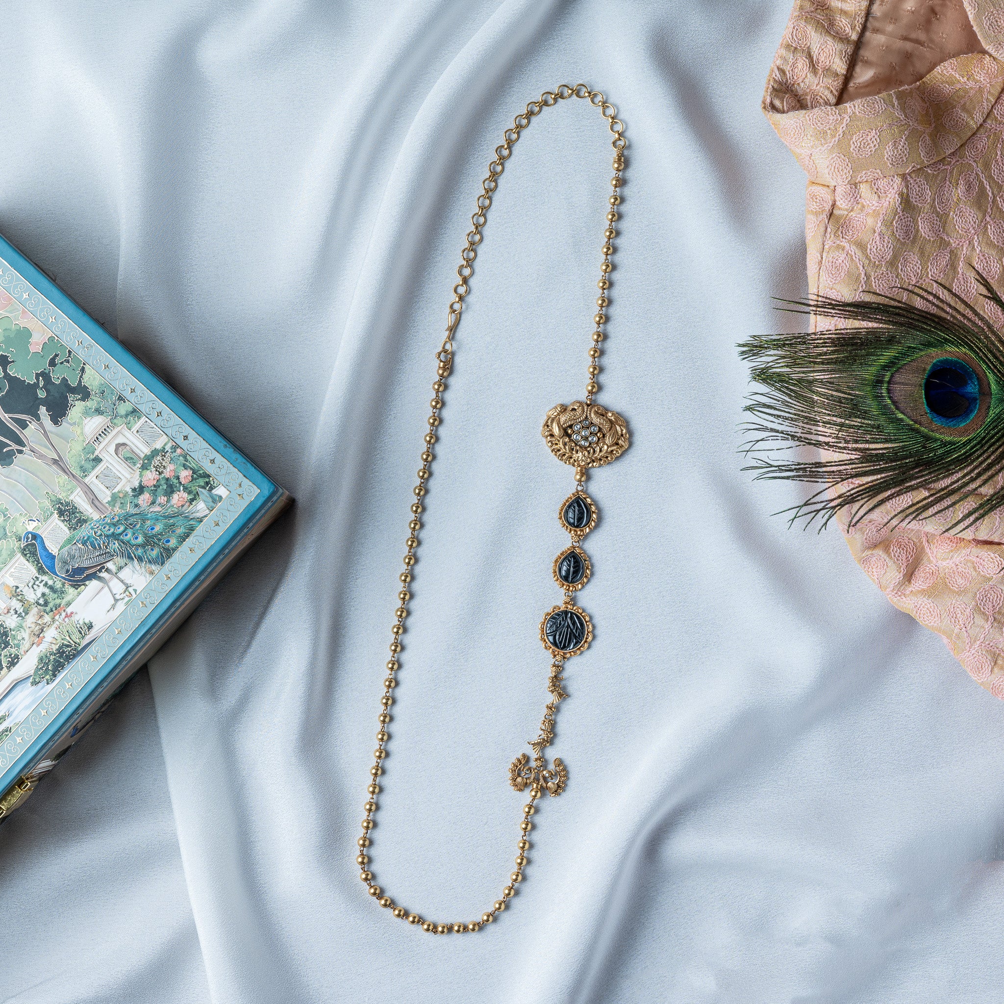 Asymmetric kundan peacock necklace with carved black onyx down one side, gold plated 925 silver