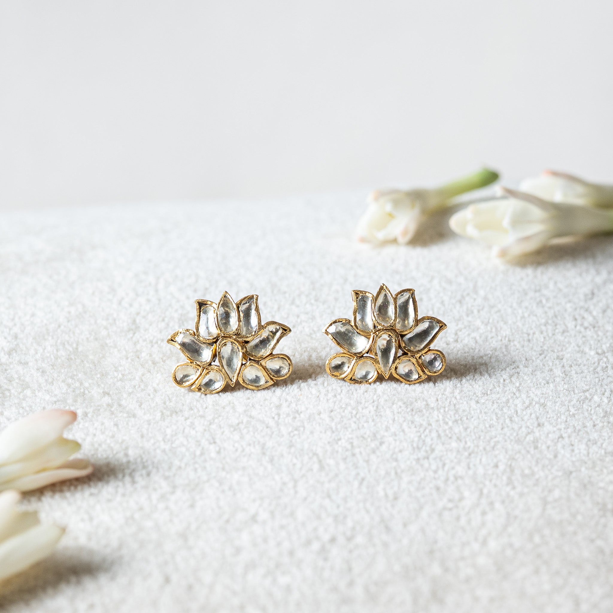 White kundan lotus studs with flat cut petal stones in raised gold cups, antique gold 925 silver