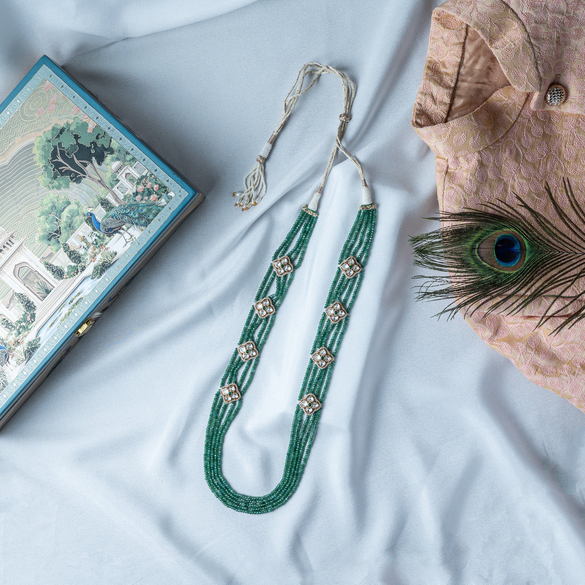Four strand green bead necklace with four petal polki spacers in gold plated 925 silver