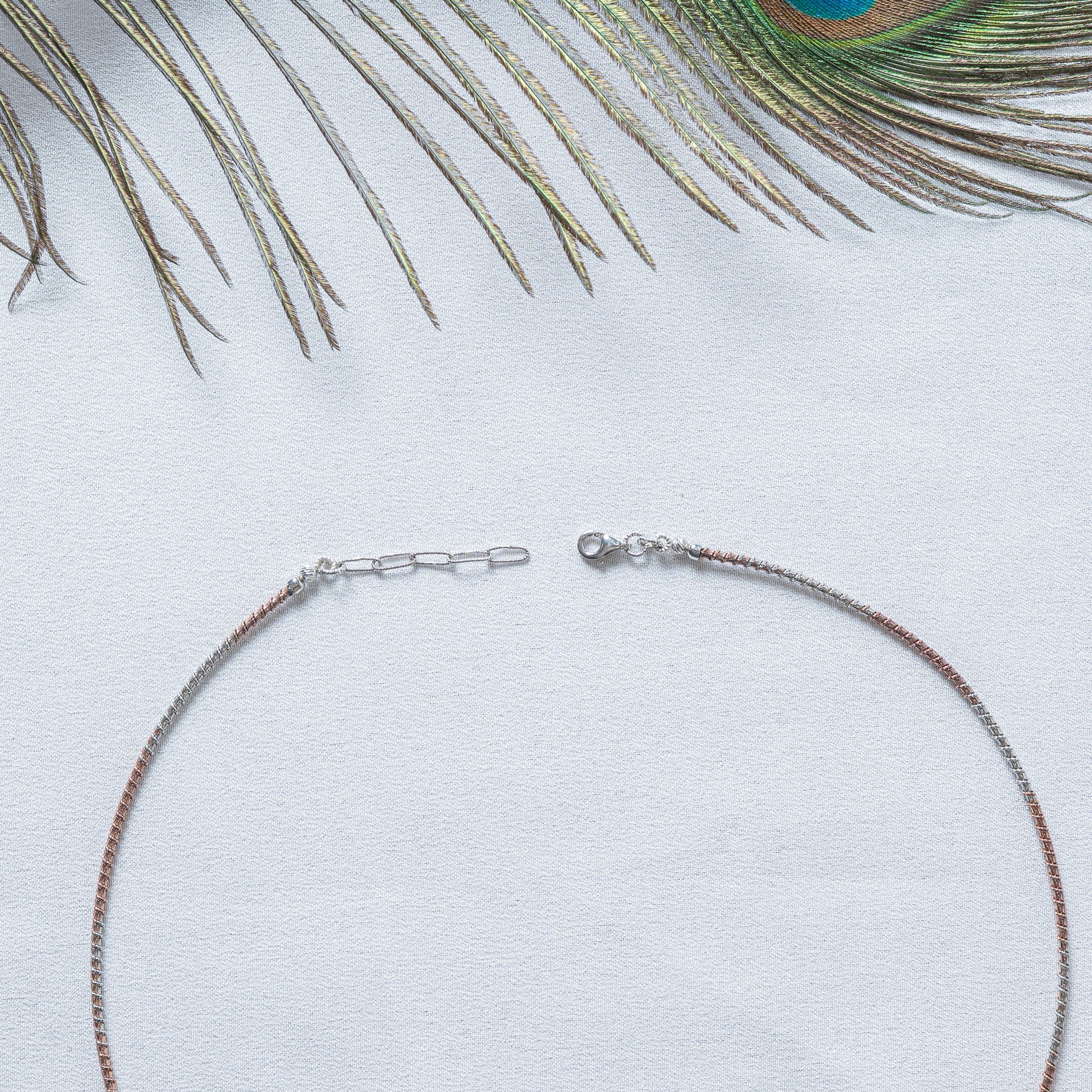 Two tone hasli collar in rose gold and white 925 silver, shown flat with its lobster clasp and extender