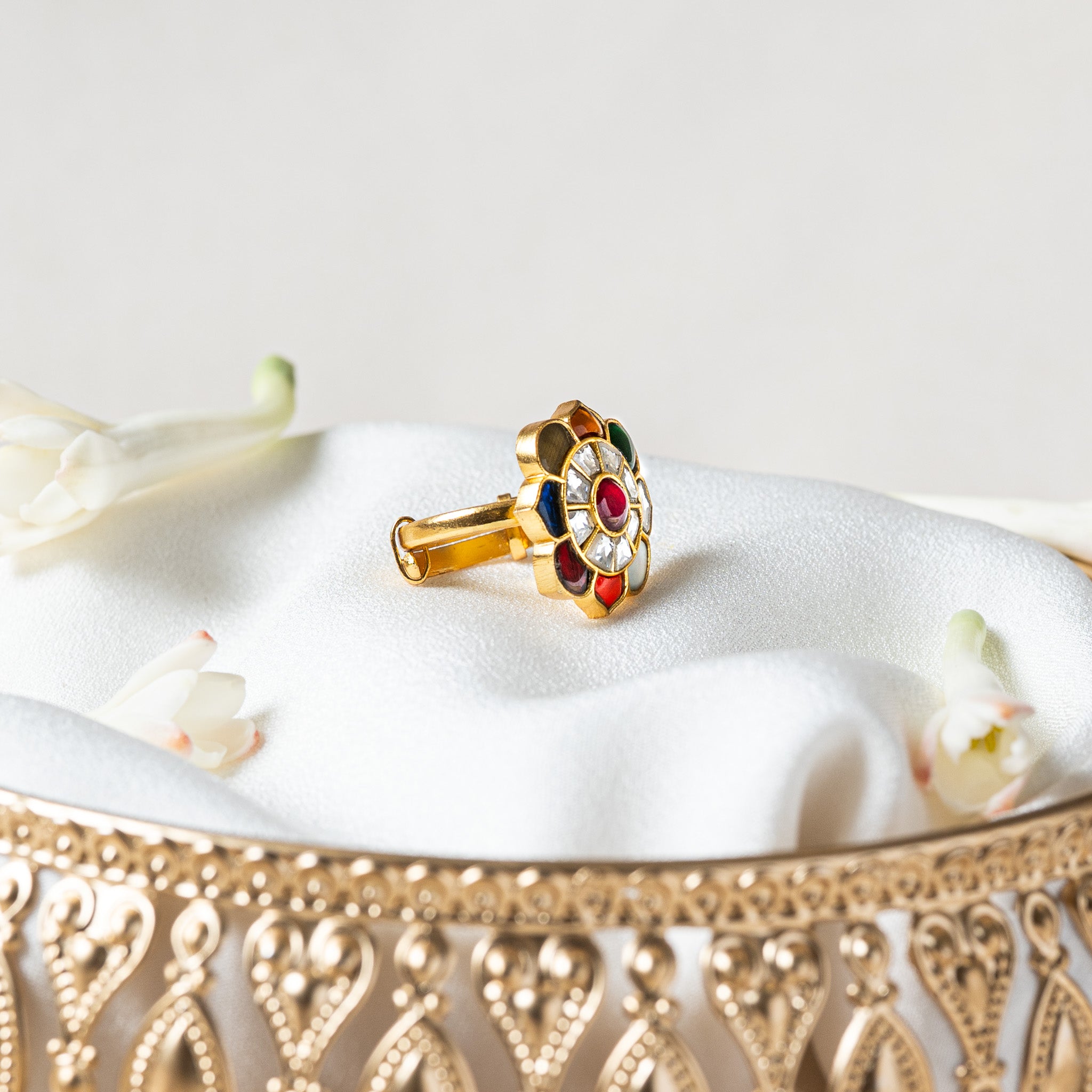 Side view of the navratna ring showing the level flat cut face and the sliding band beneath