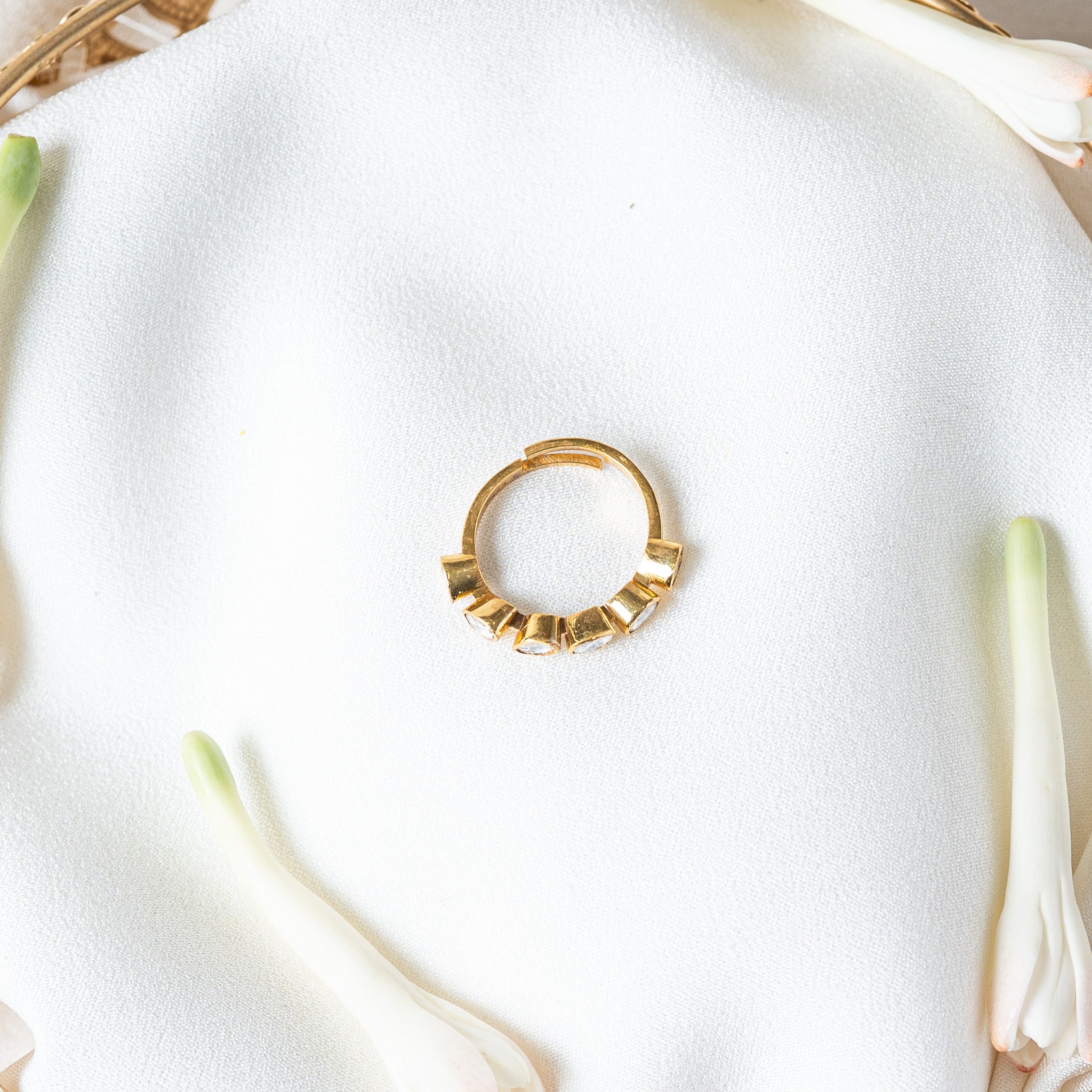 Side view of the polki eternity ring with the end cup turned outward to show its stone