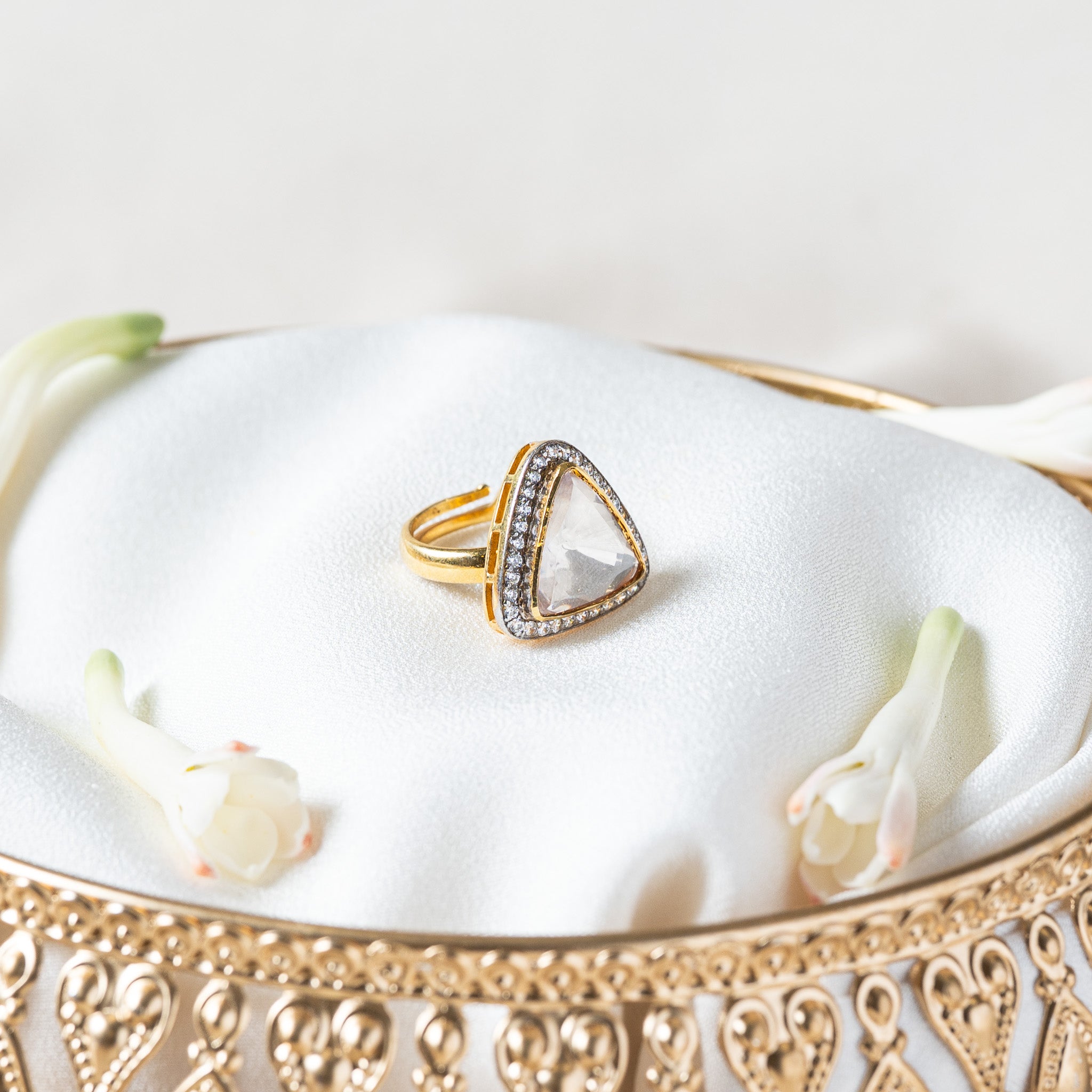 Side profile of the trillion polki ring showing the raised head and the metal cut through beneath