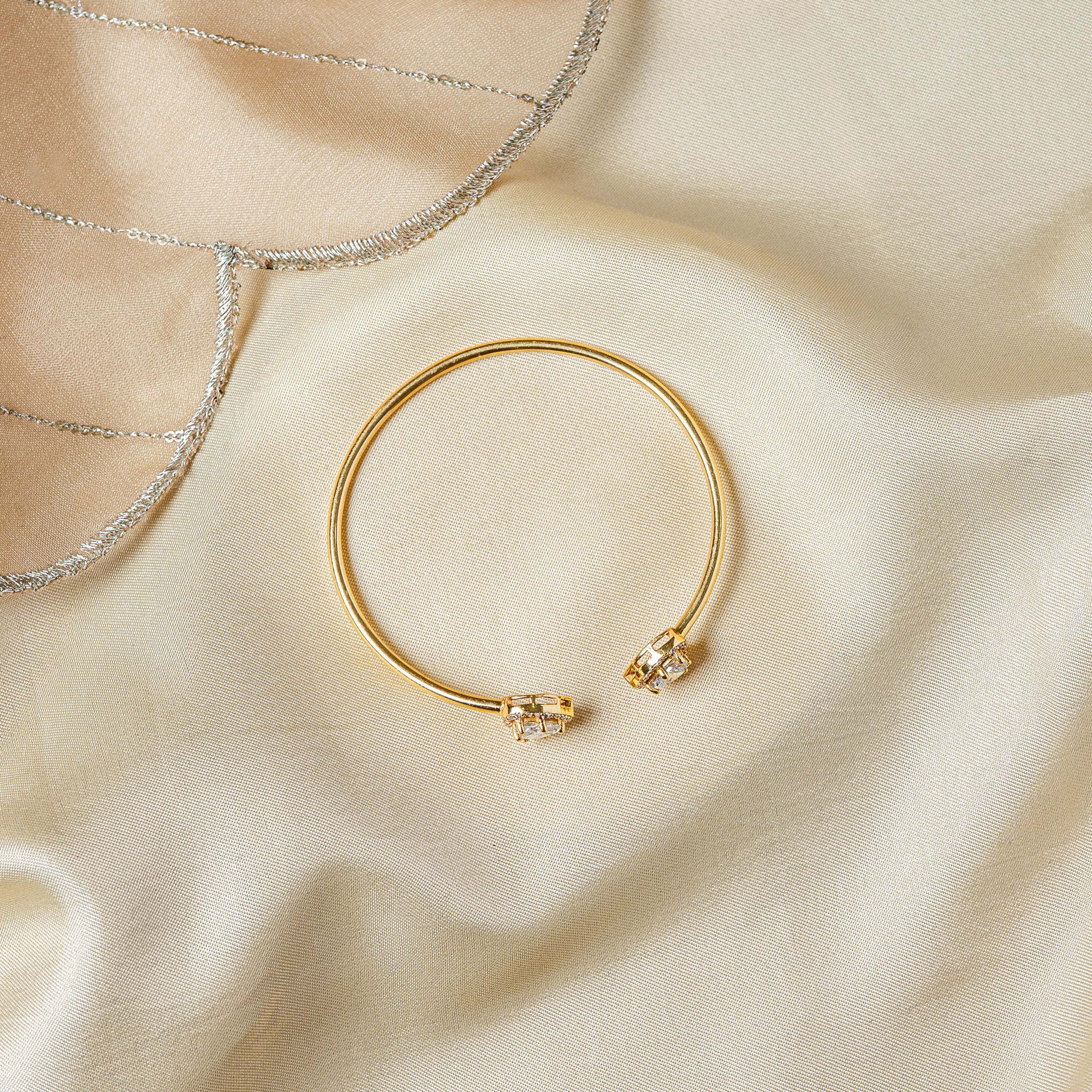 Flat lay of the open cuff from above showing the gap between the two heart terminals