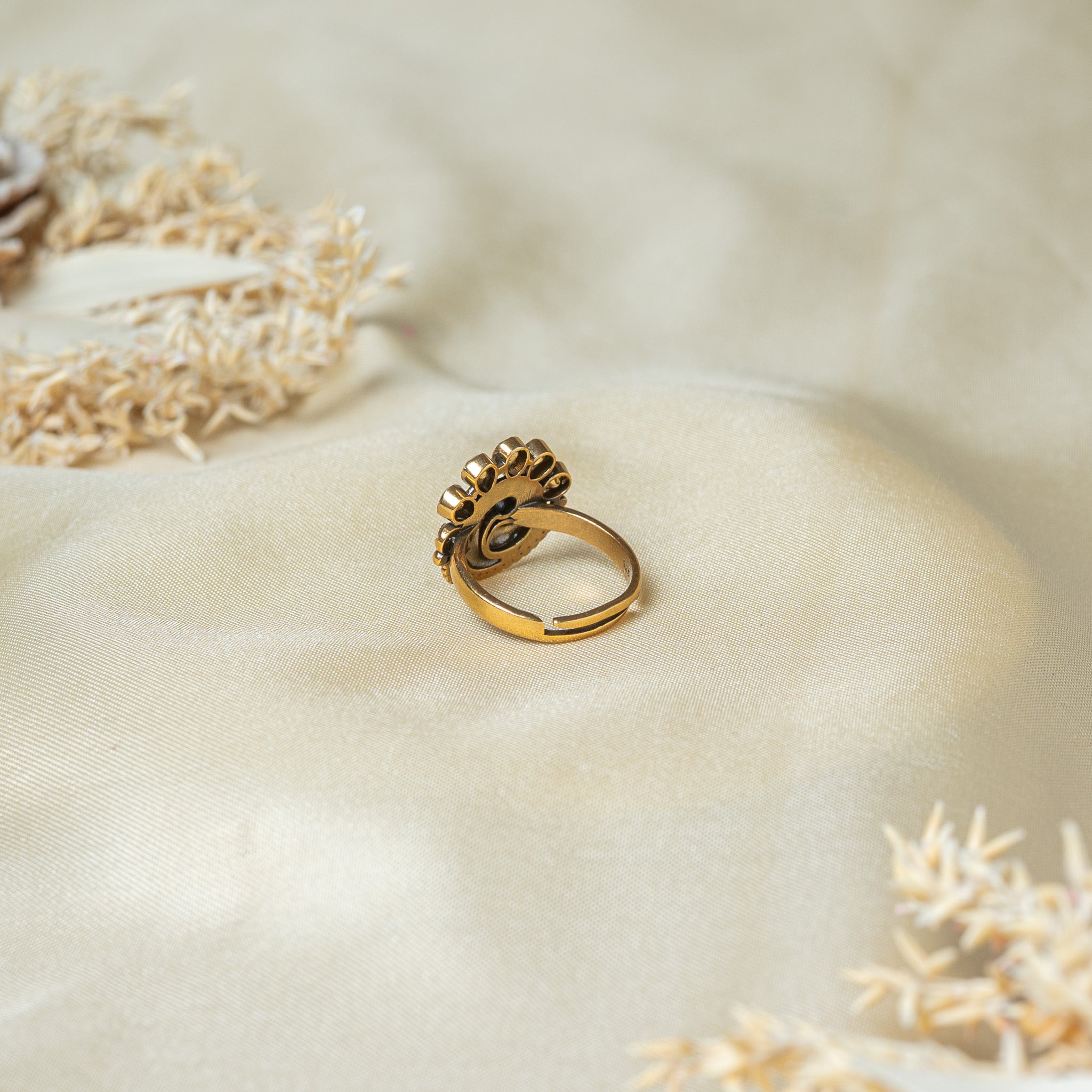 Back of the peacock ring showing the oxidised recesses and the band cut open to adjust