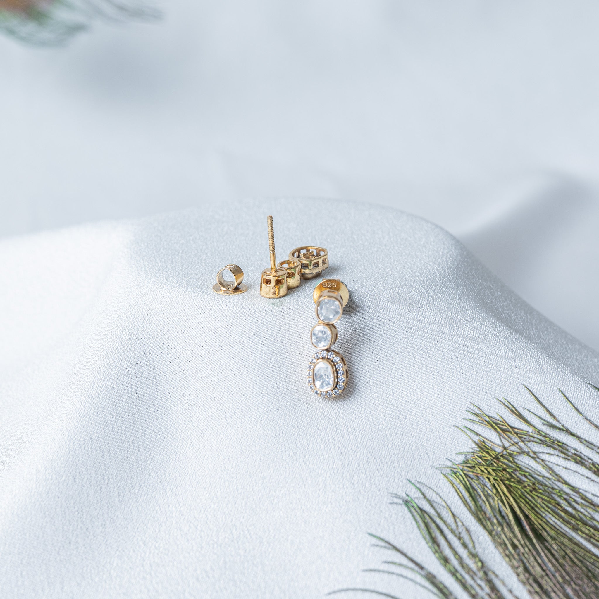 Back of the drop earring showing the open backed settings and the threaded screw post