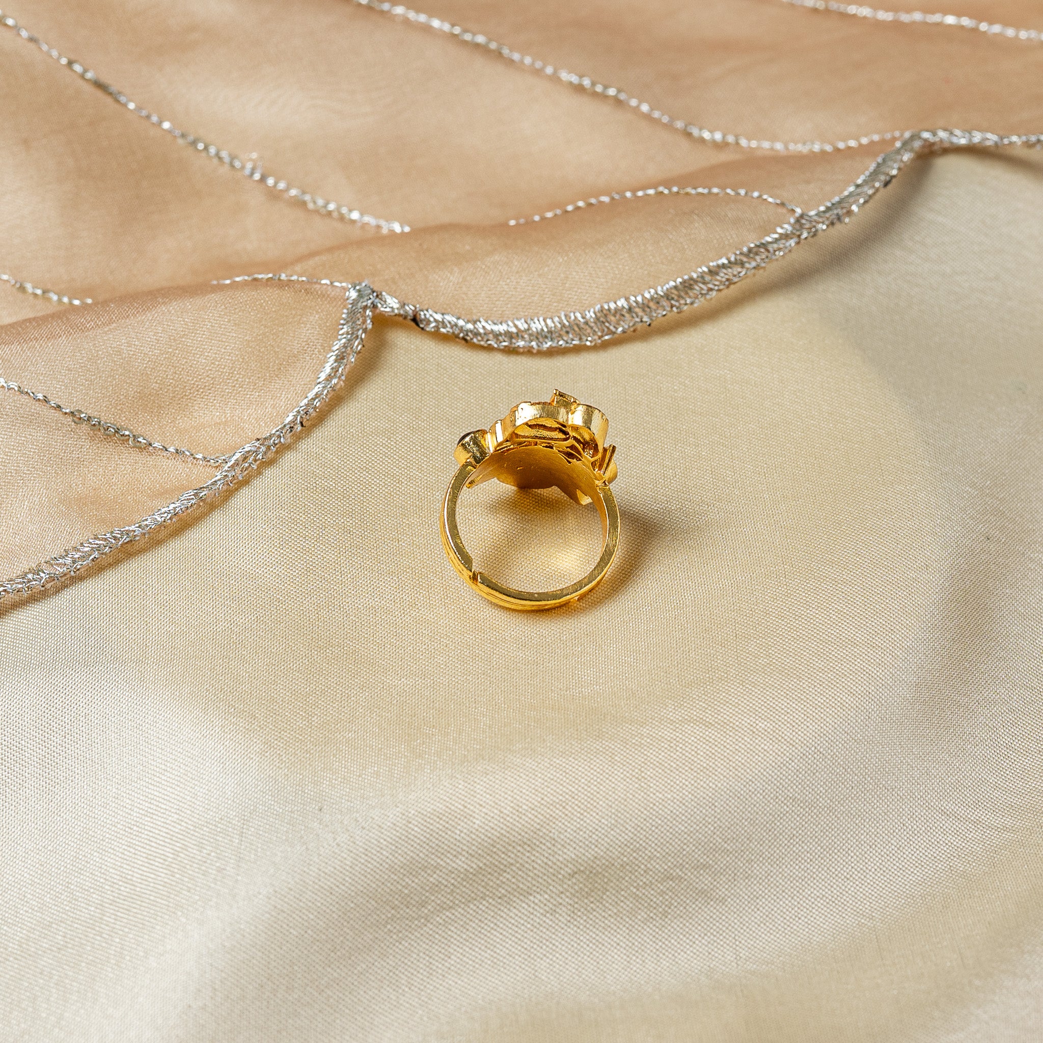 Underside of the elephant ring showing the cut band ends lying past each other so it adjusts
