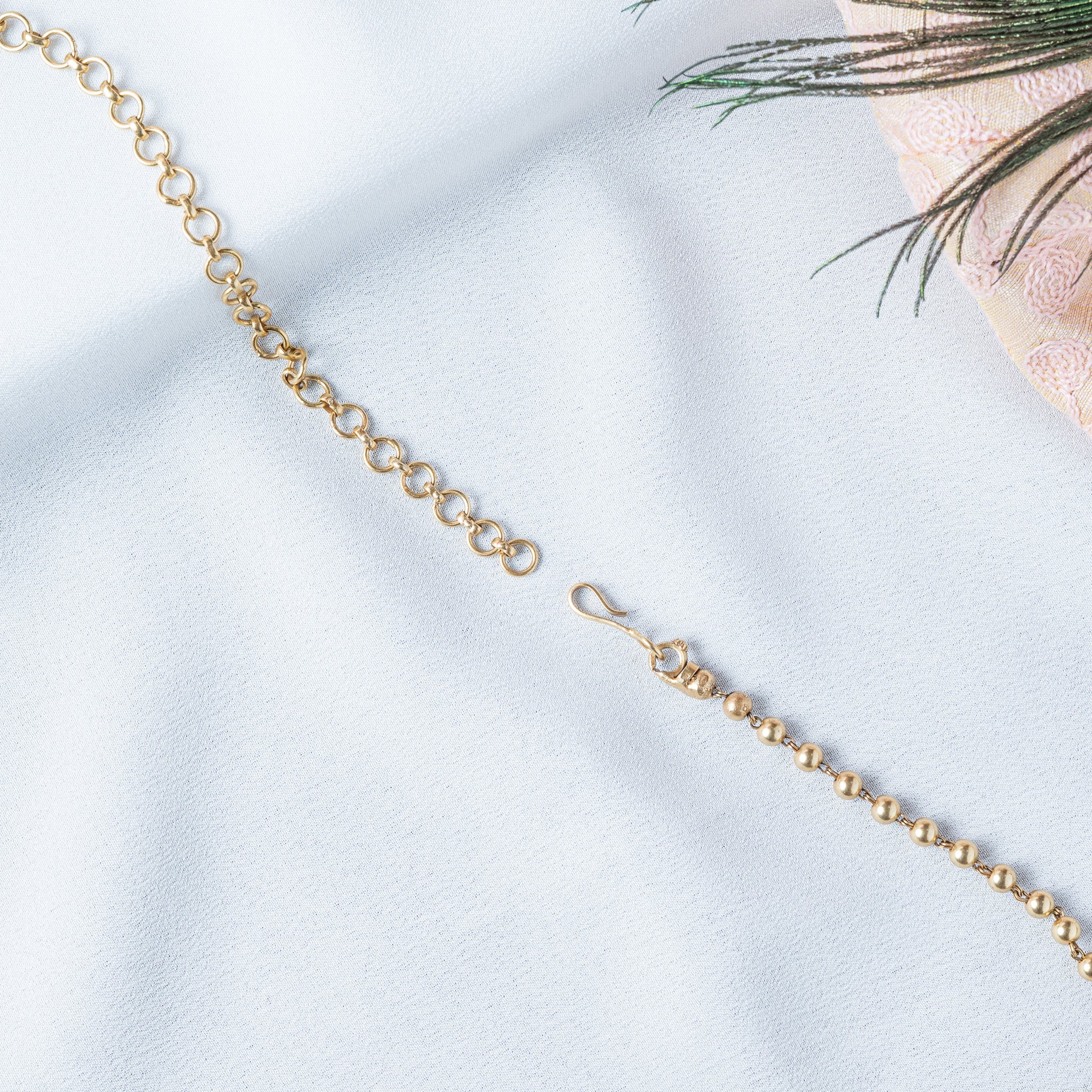 Back of the necklace showing the S hook and round link extender on the ball chain