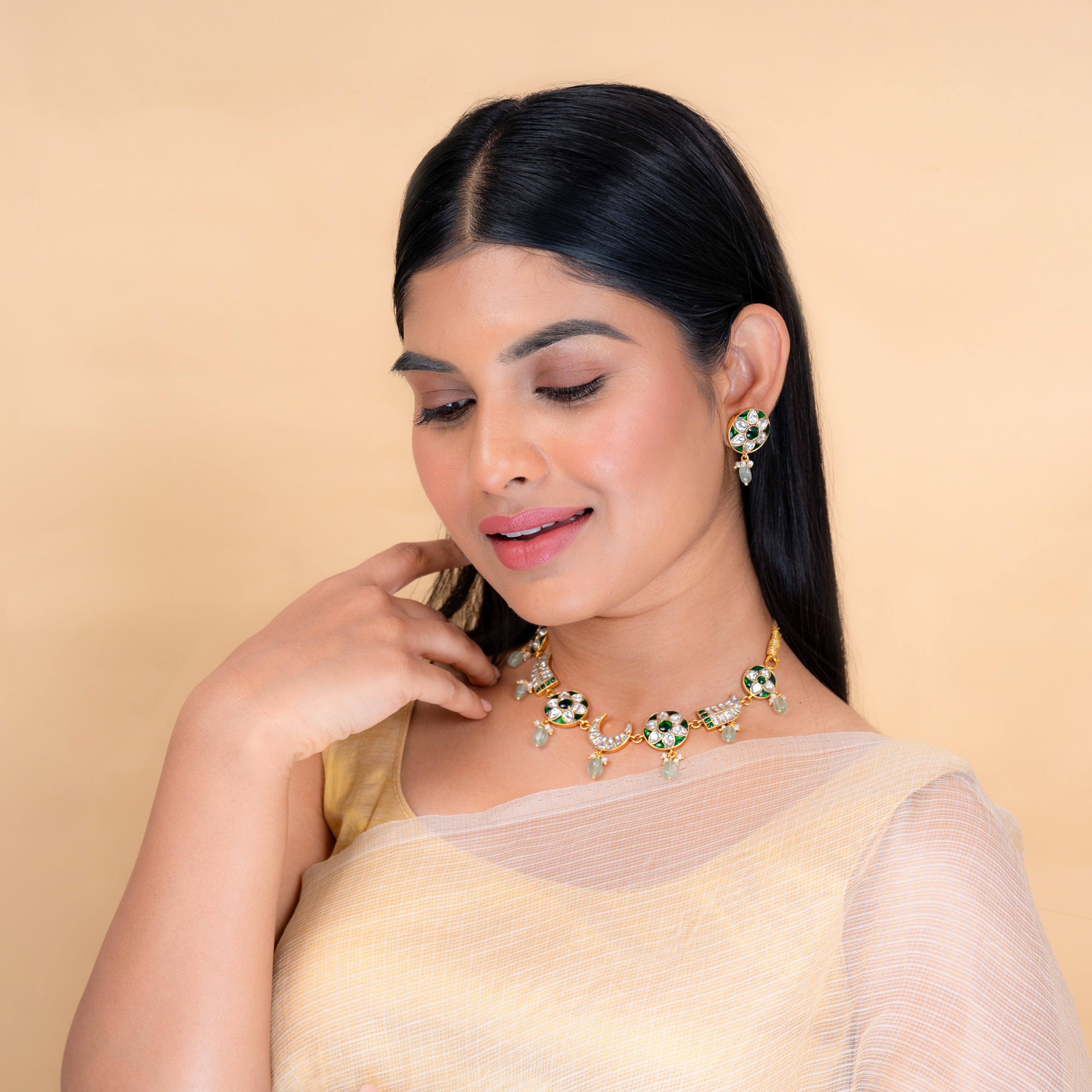 Model wearing Nurvi Jadau necklace in 925 silver with green bead detailing and intricate handcrafted motifs